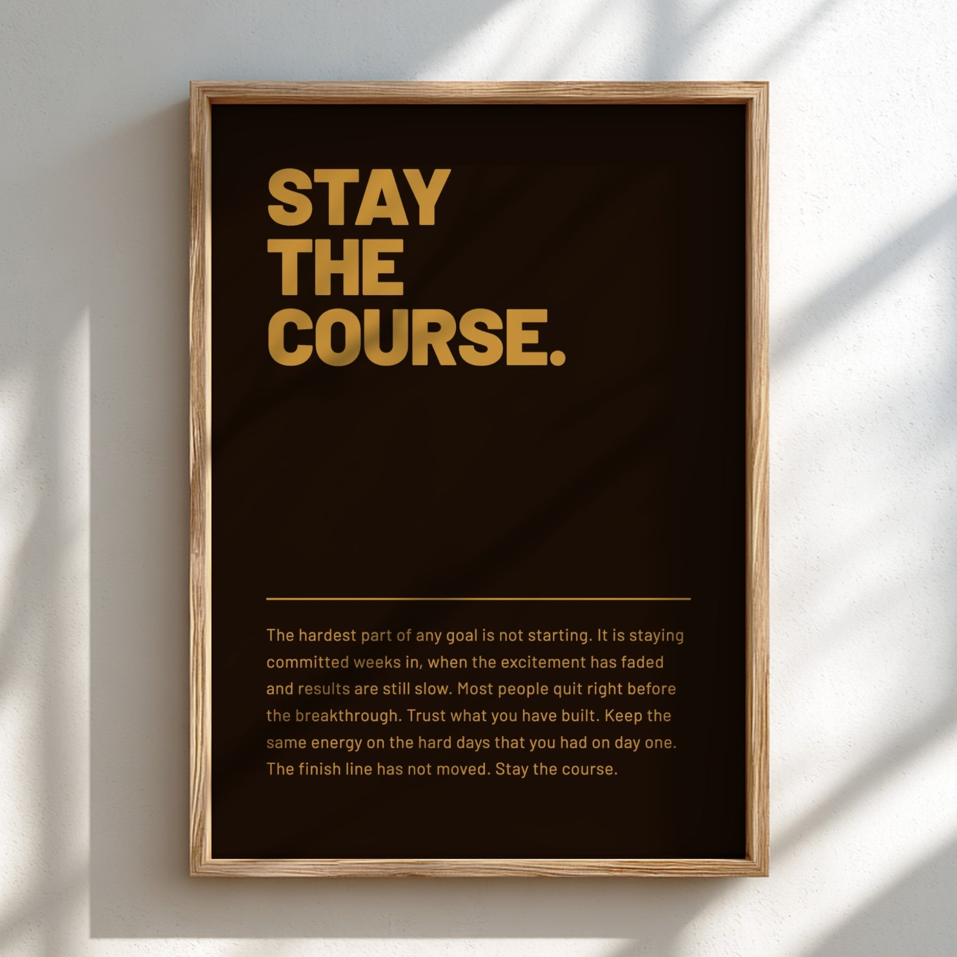 Framed poster with 'Stay the Course' text on a dark background