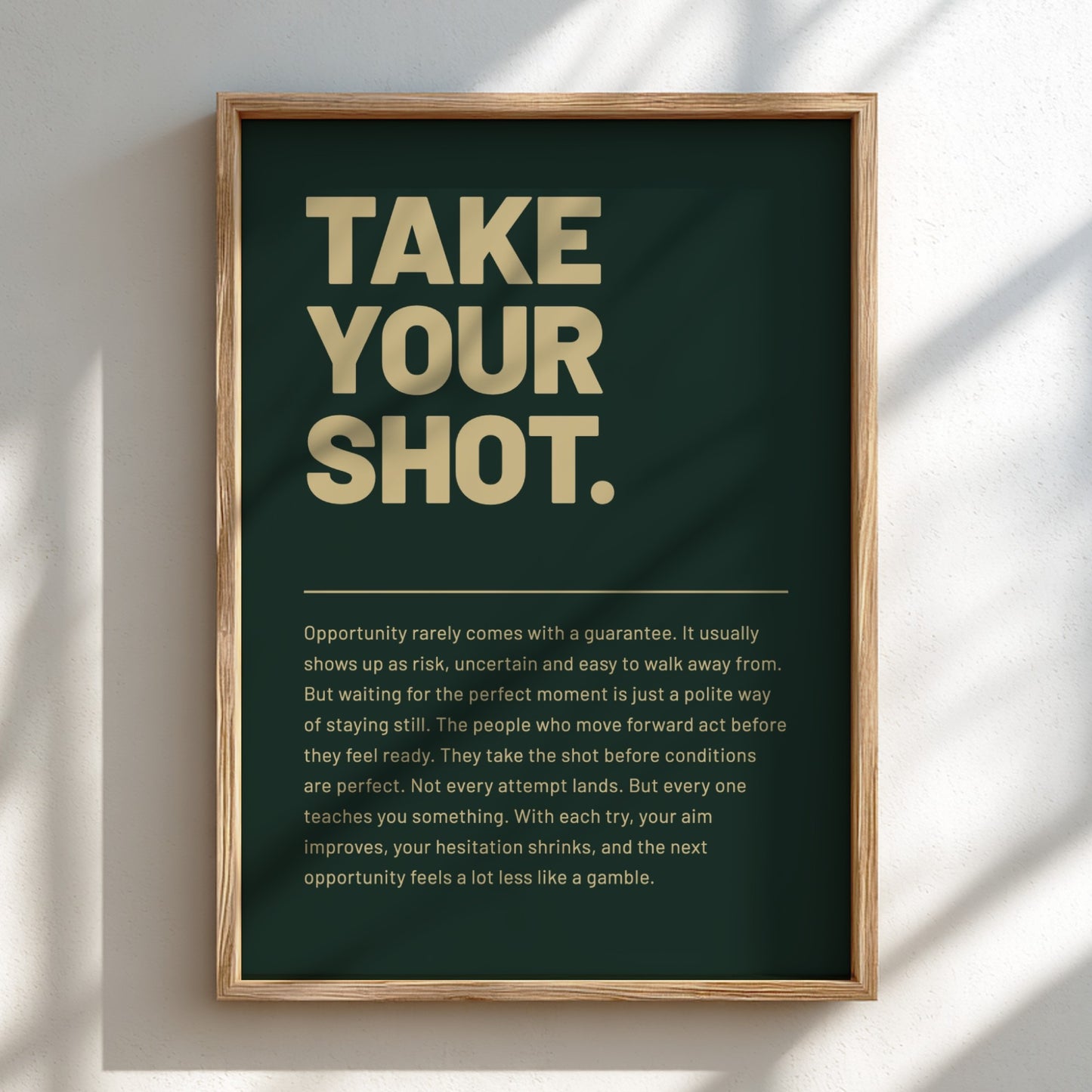 Framed poster with motivational quote 'Take Your Shot' on a dark green background