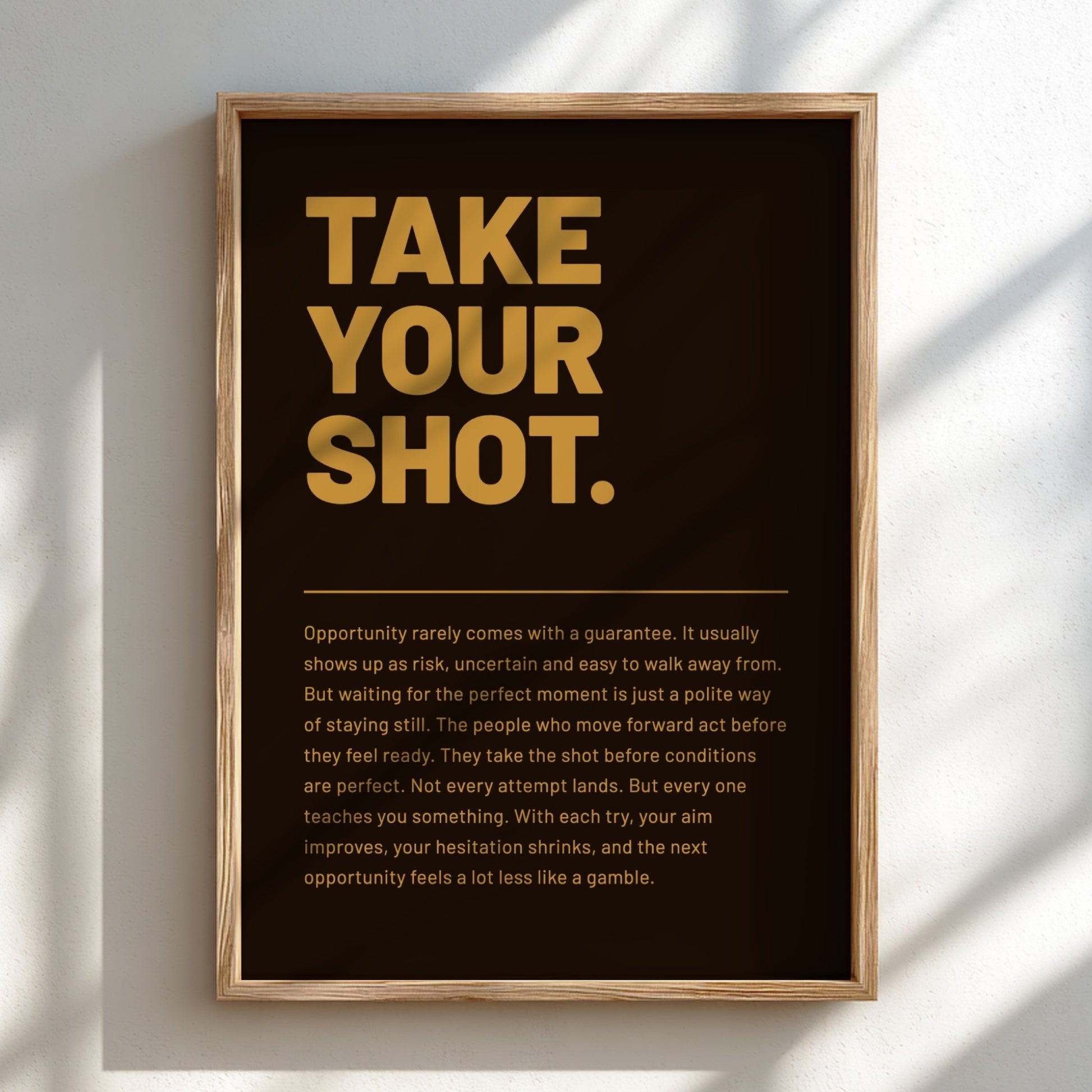 Framed poster with motivational quote 'Take Your Shot' on a dark background