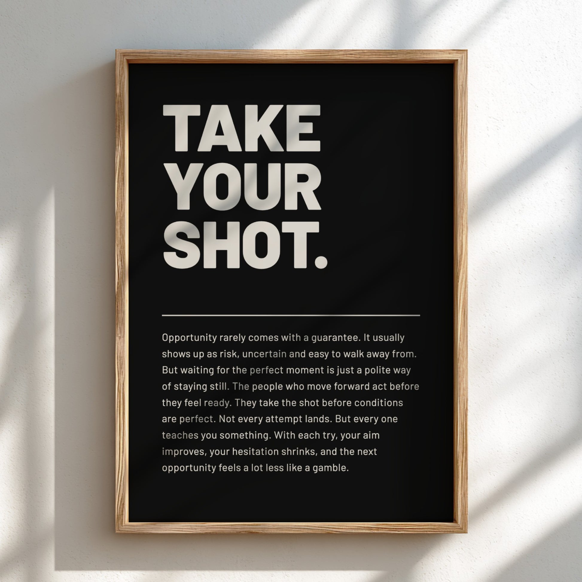 Framed poster with motivational quote 'Take Your Shot' on a black background