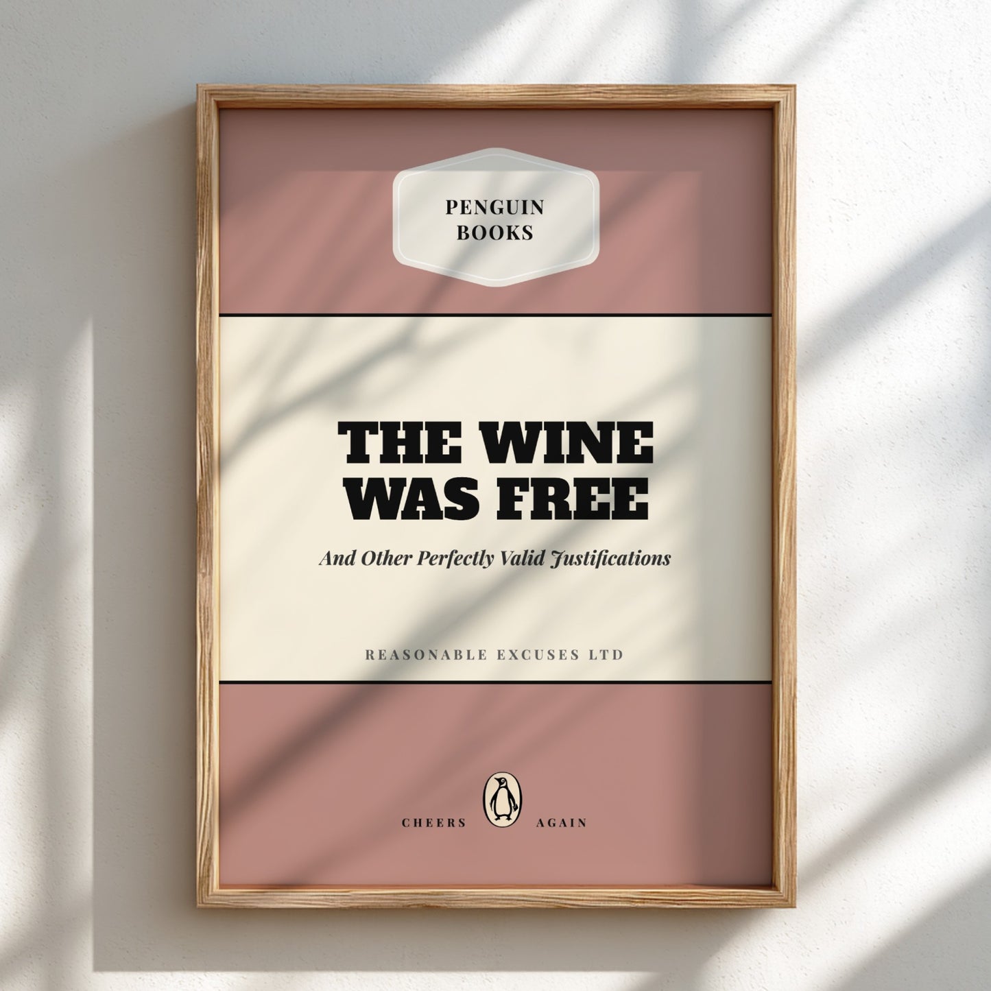 Framed book cover with 'Penguin Books' logo and text 'The Wine Was Free'