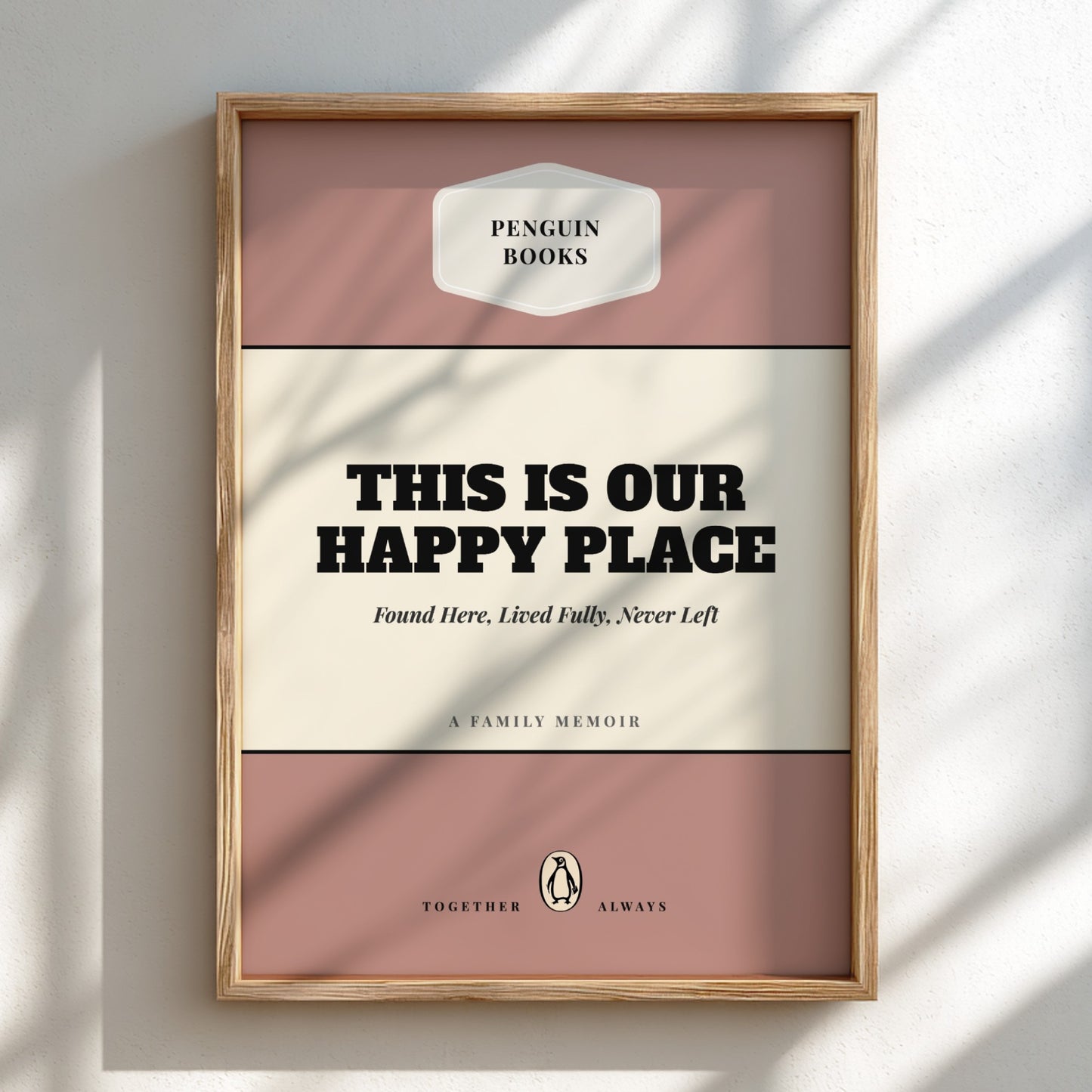 Framed book cover with 'Penguin Books' logo and text 'This is our happy place'.