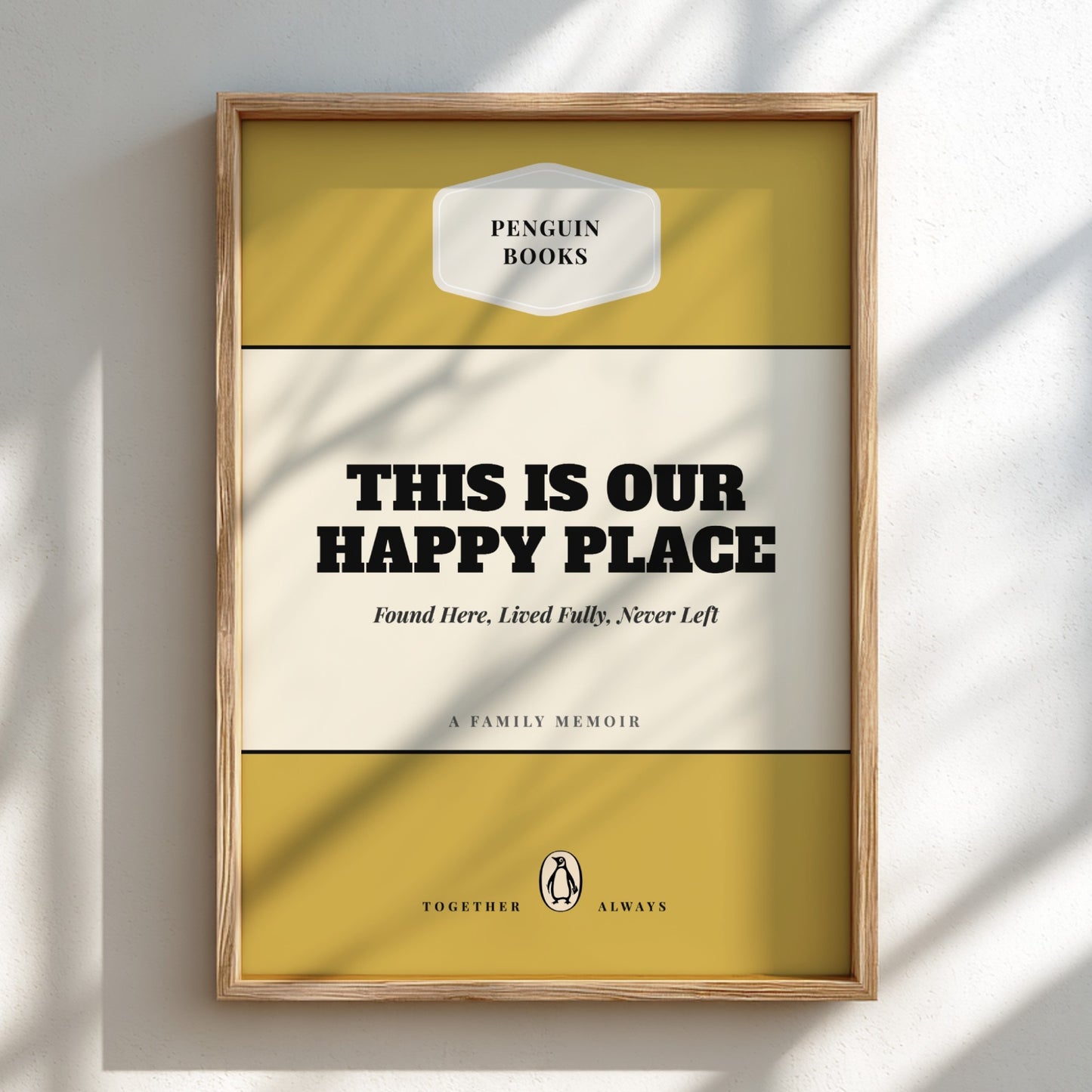 Framed book cover with 'Penguin Books' logo and text 'This is our happy place'.