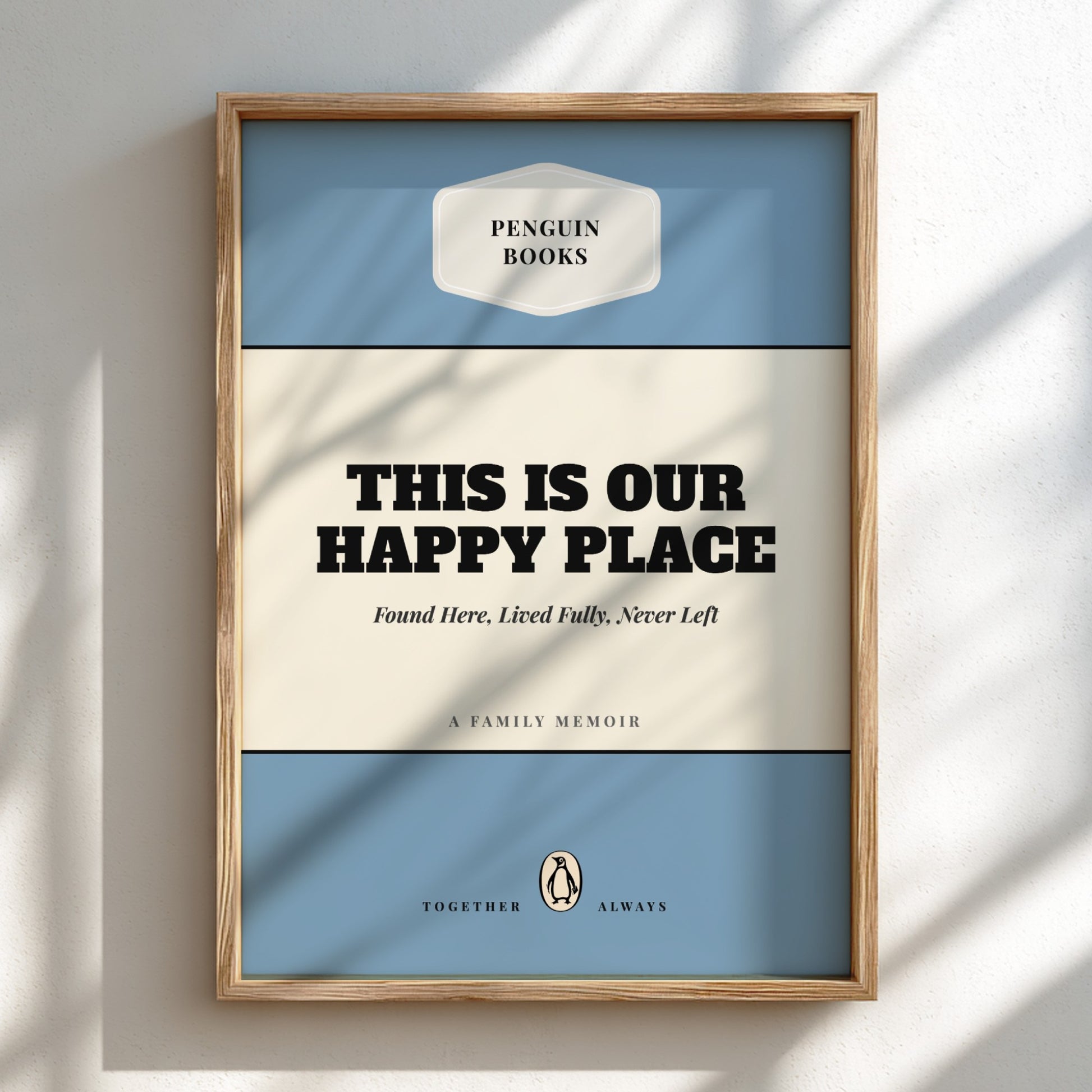 Framed book cover with 'Penguin Books' logo and text 'This is our happy place'.