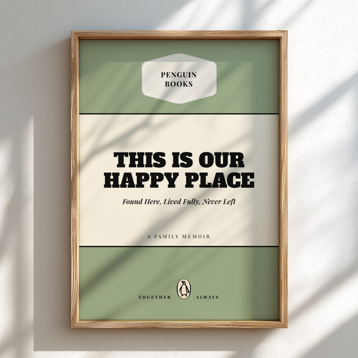 Framed book cover with 'Penguin Books' logo and text 'This is our happy place'.