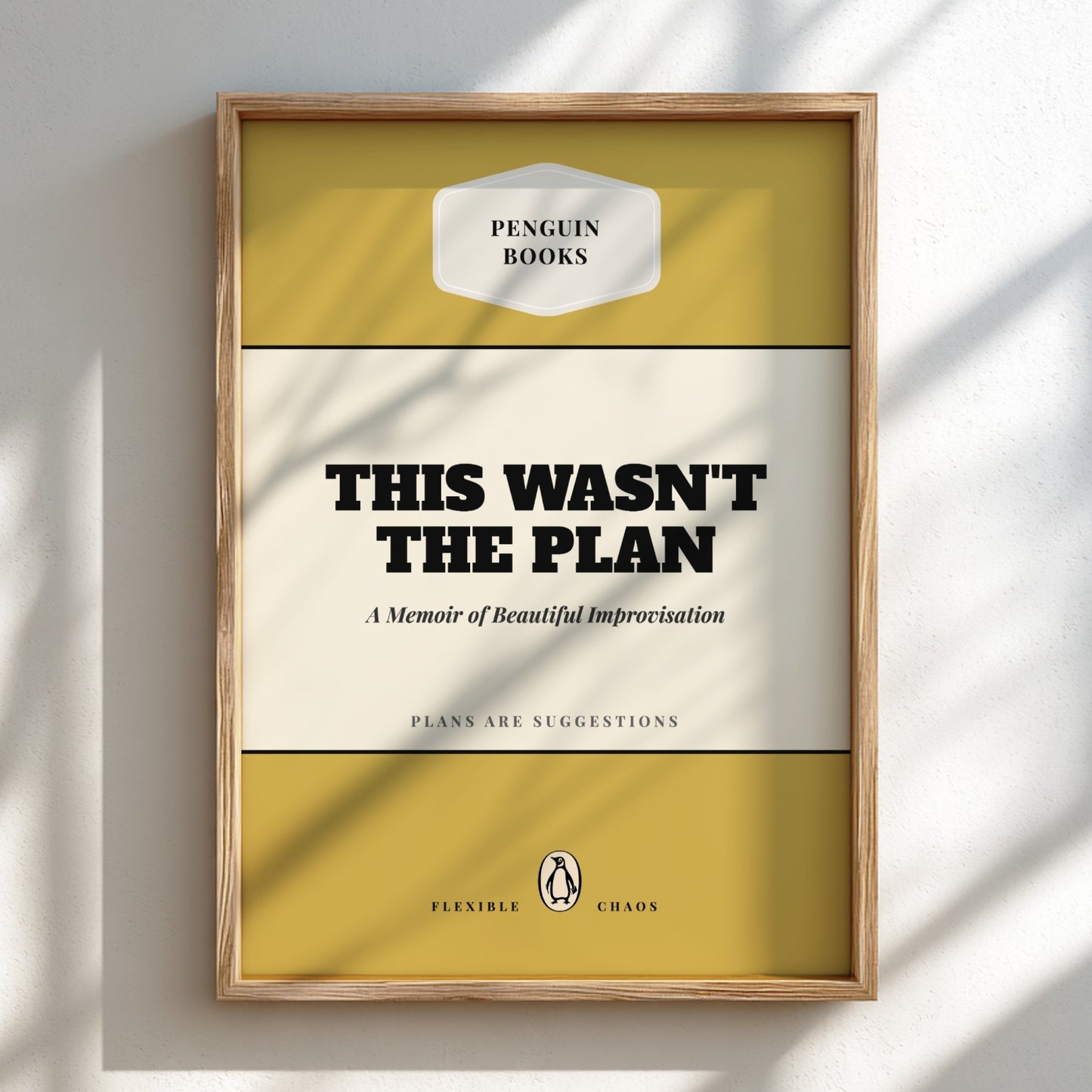 Framed book cover of 'This Wasn't the Plan' by Penguin Books on a light background