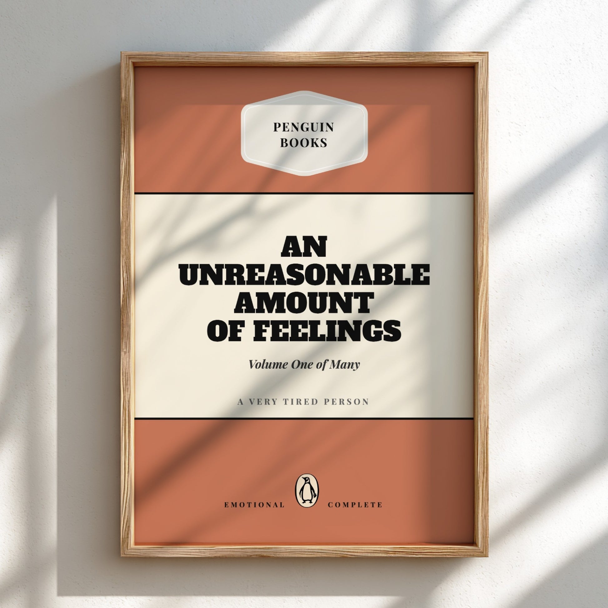 Framed book cover of 'An Unreasonable Amount of Feelings' by Penguin Books on a light background