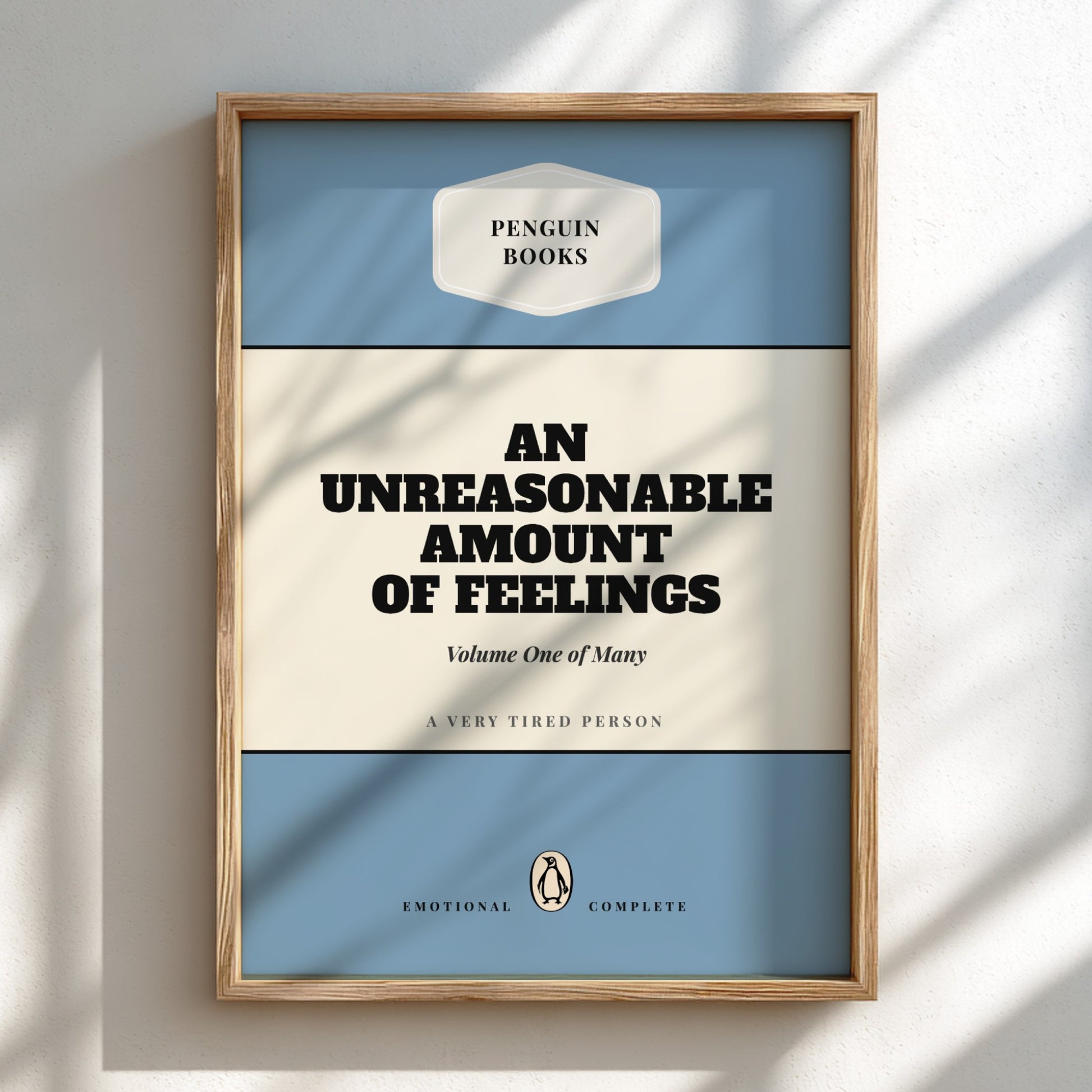 Framed book cover of 'An Unreasonable Amount of Feelings' by Penguin Books on a light background