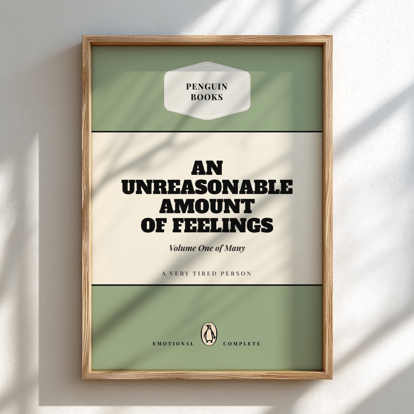 Framed book cover of 'An Unreasonable Amount of Feelings' by Penguin Books on a light background