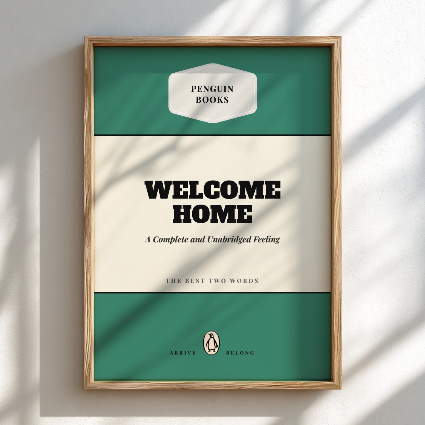 Framed poster with 'Penguin Books' design and text 'Welcome Home'