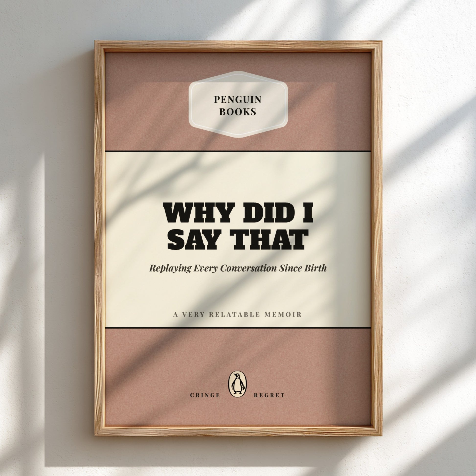 Framed book titled 'Why Did I Say That' by Penguin Books on a light background