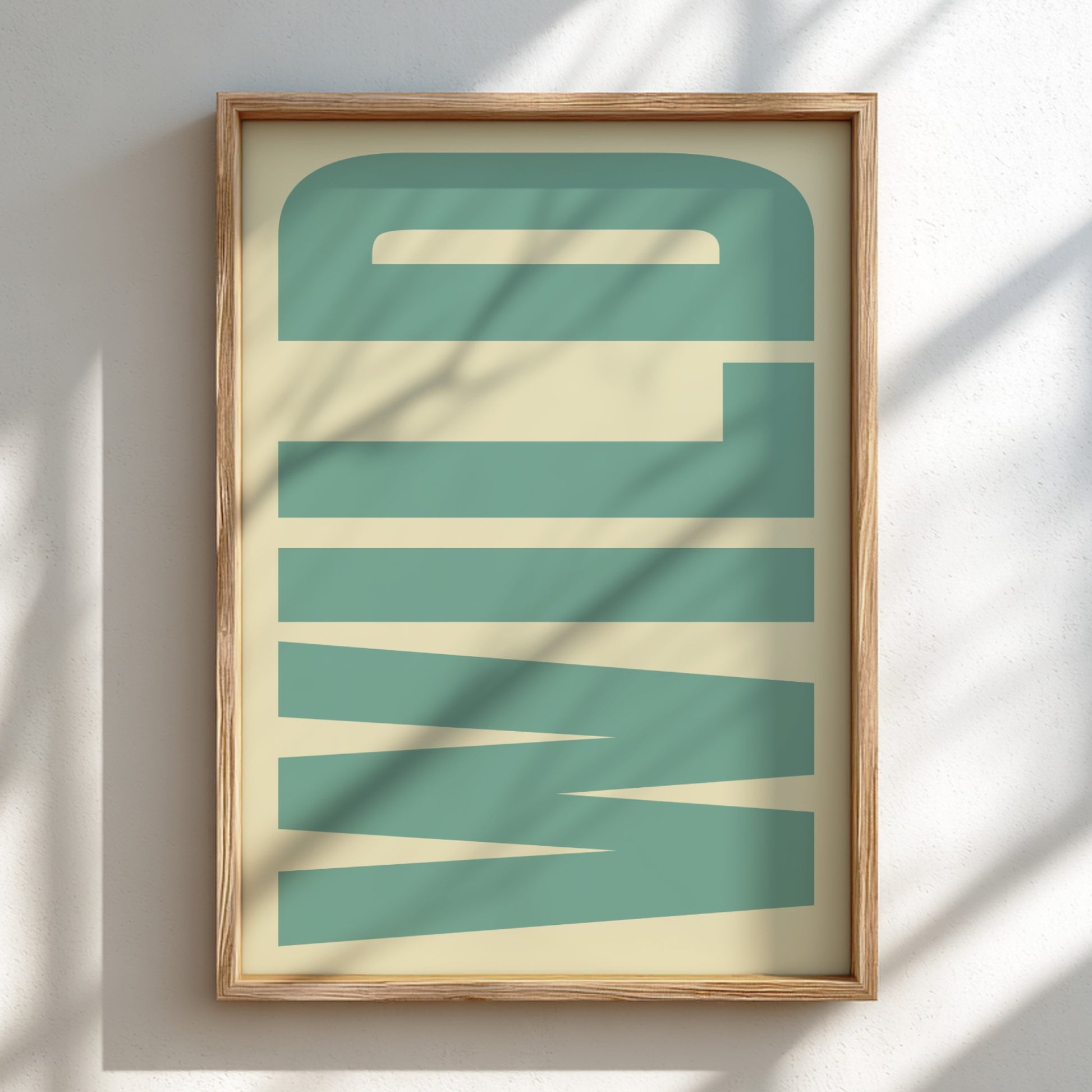 Framed abstract art print with geometric design on a light background