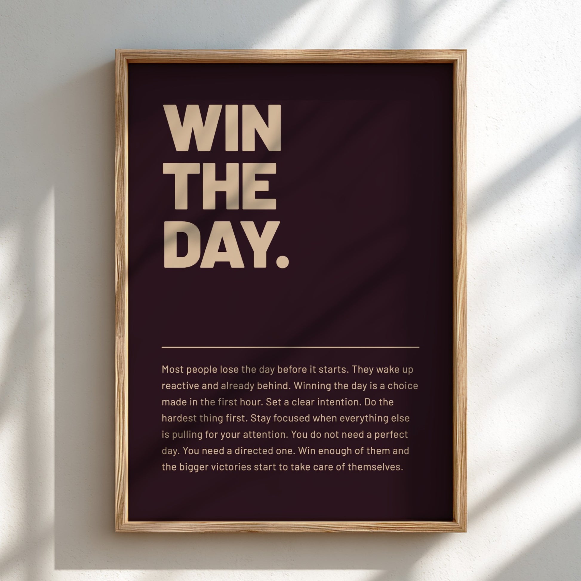 Framed motivational poster with text 'WIN THE DAY.' on a dark background