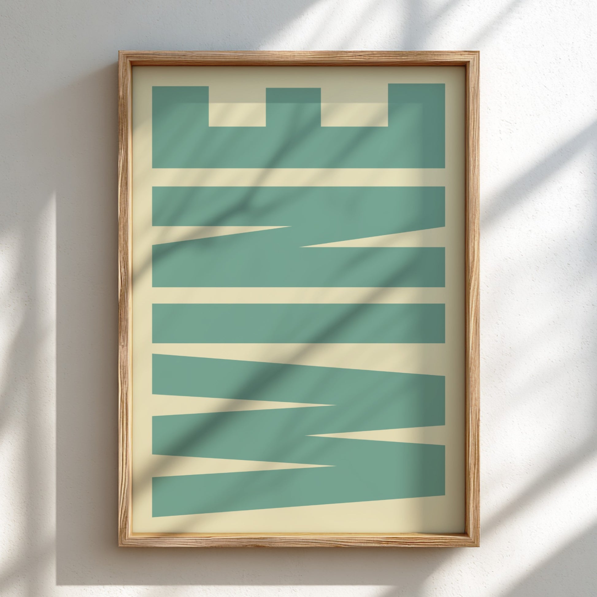 Framed abstract art print with geometric shapes on a light background