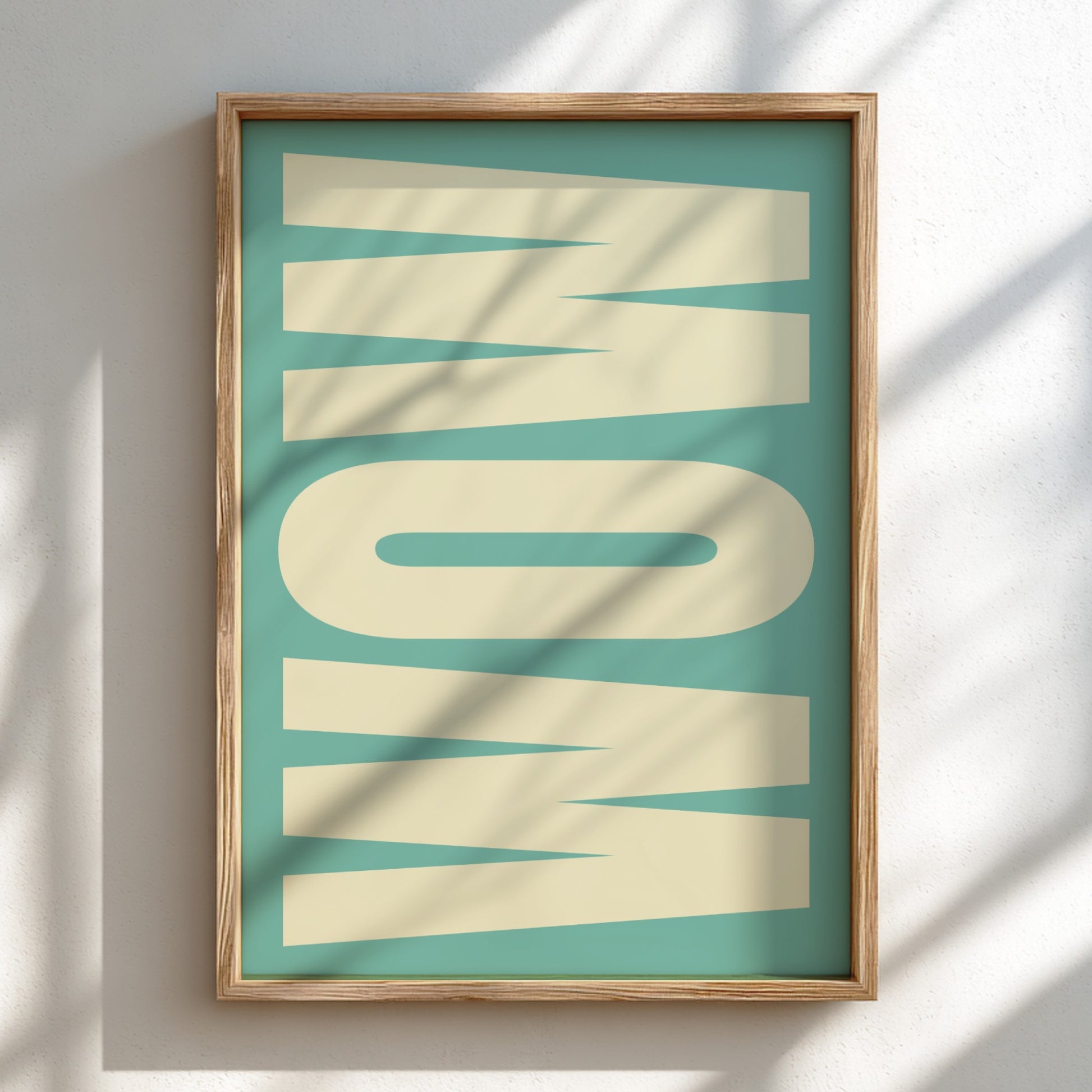 Framed artwork with the word 'WOW' on a teal background