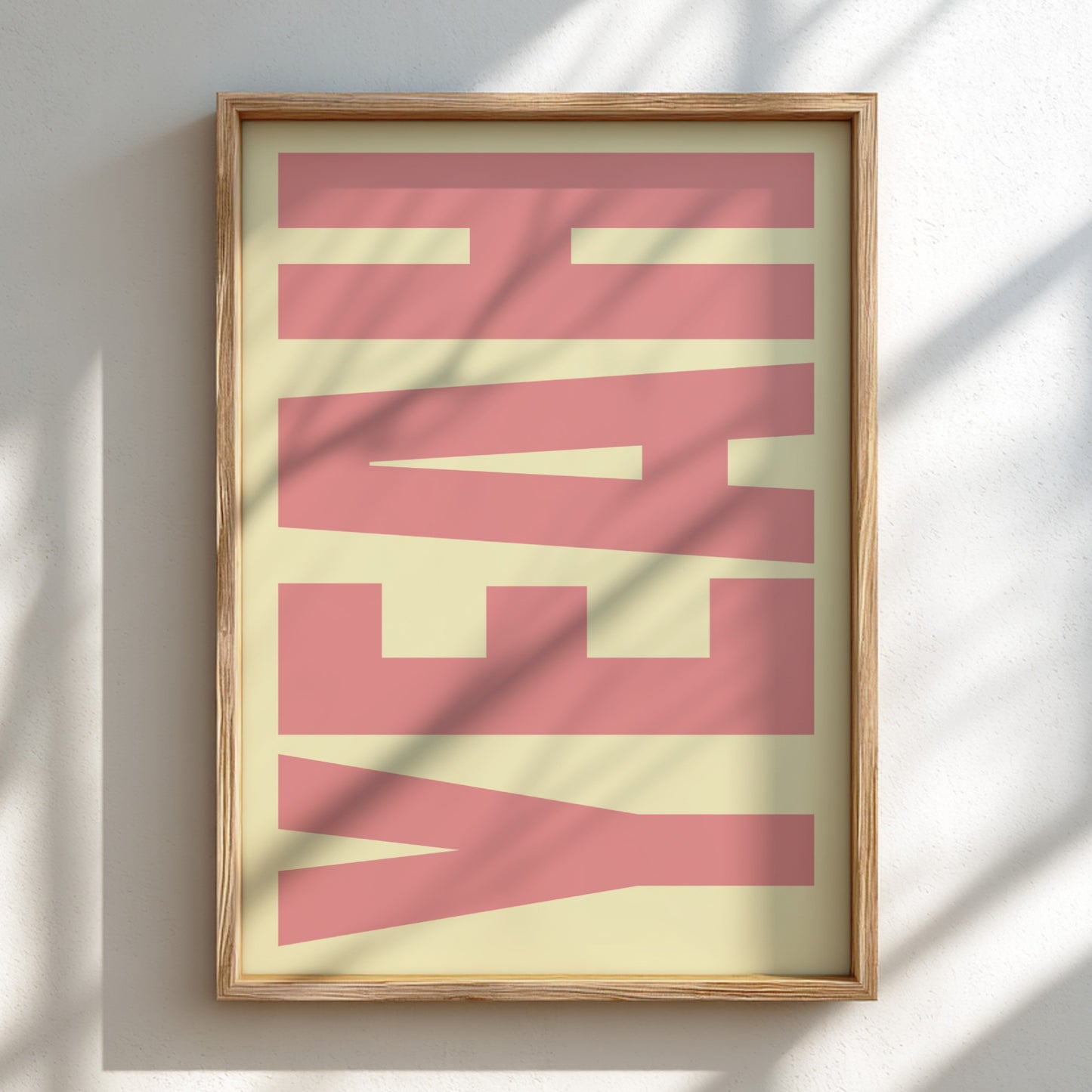 Framed artwork with 'HEAVY' text on a light background
