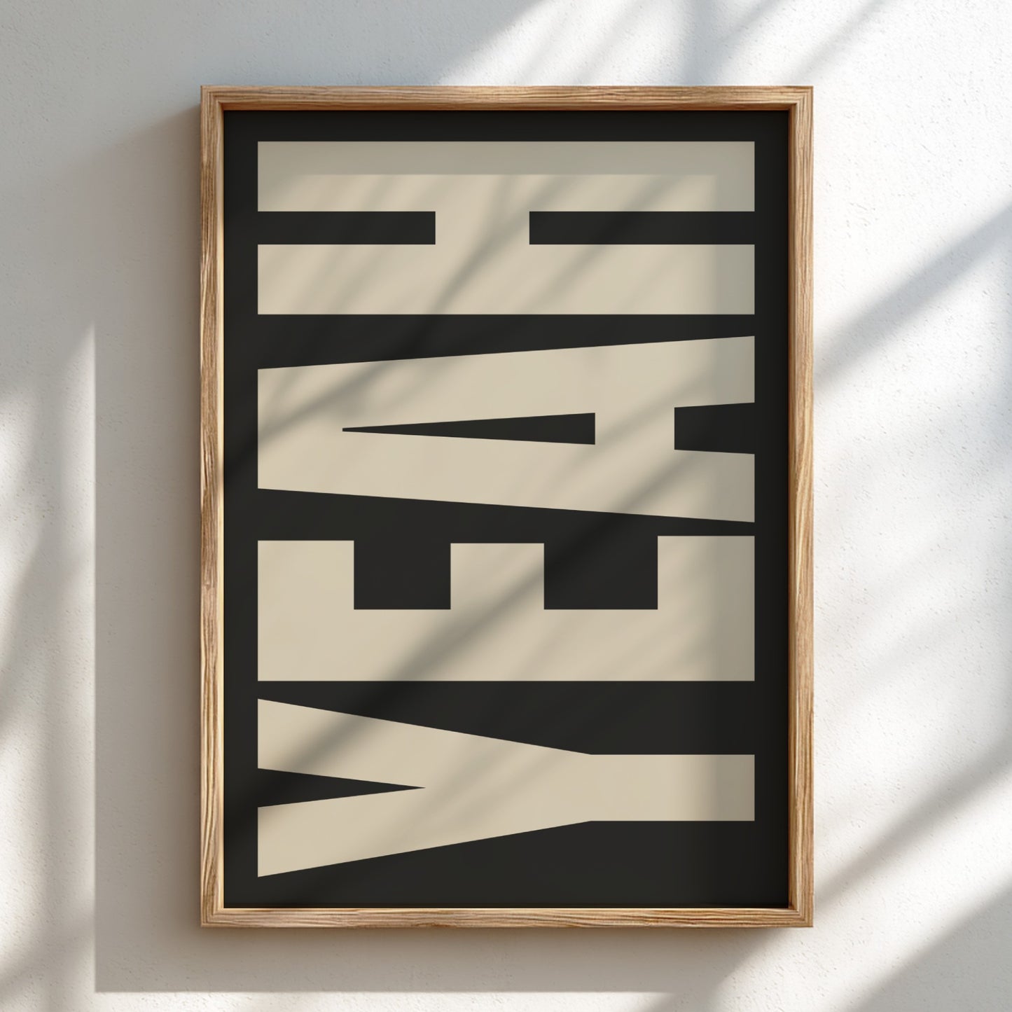 Framed artwork with the word 'YEAH' on a black background