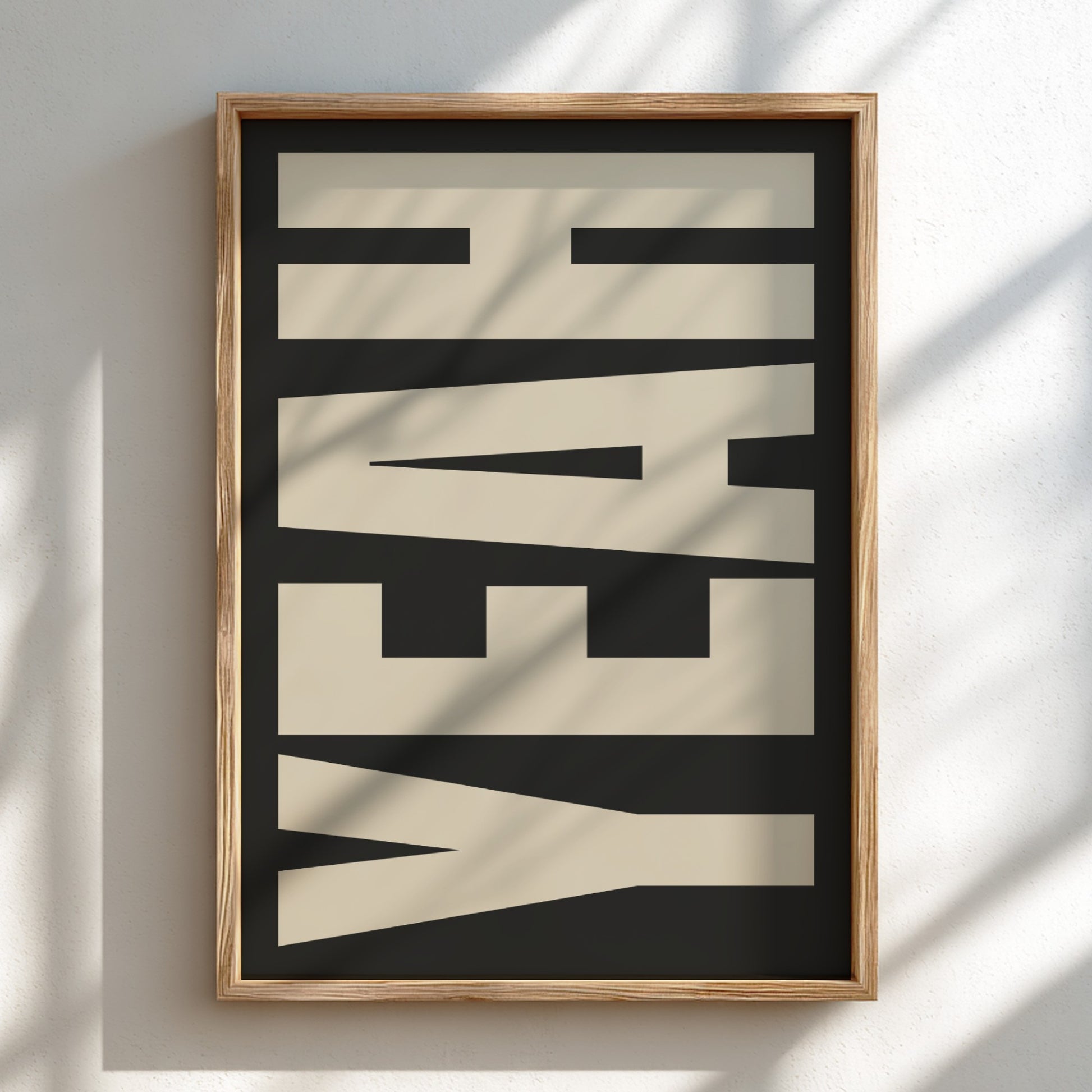 Framed artwork with the word 'YEAH' on a black background