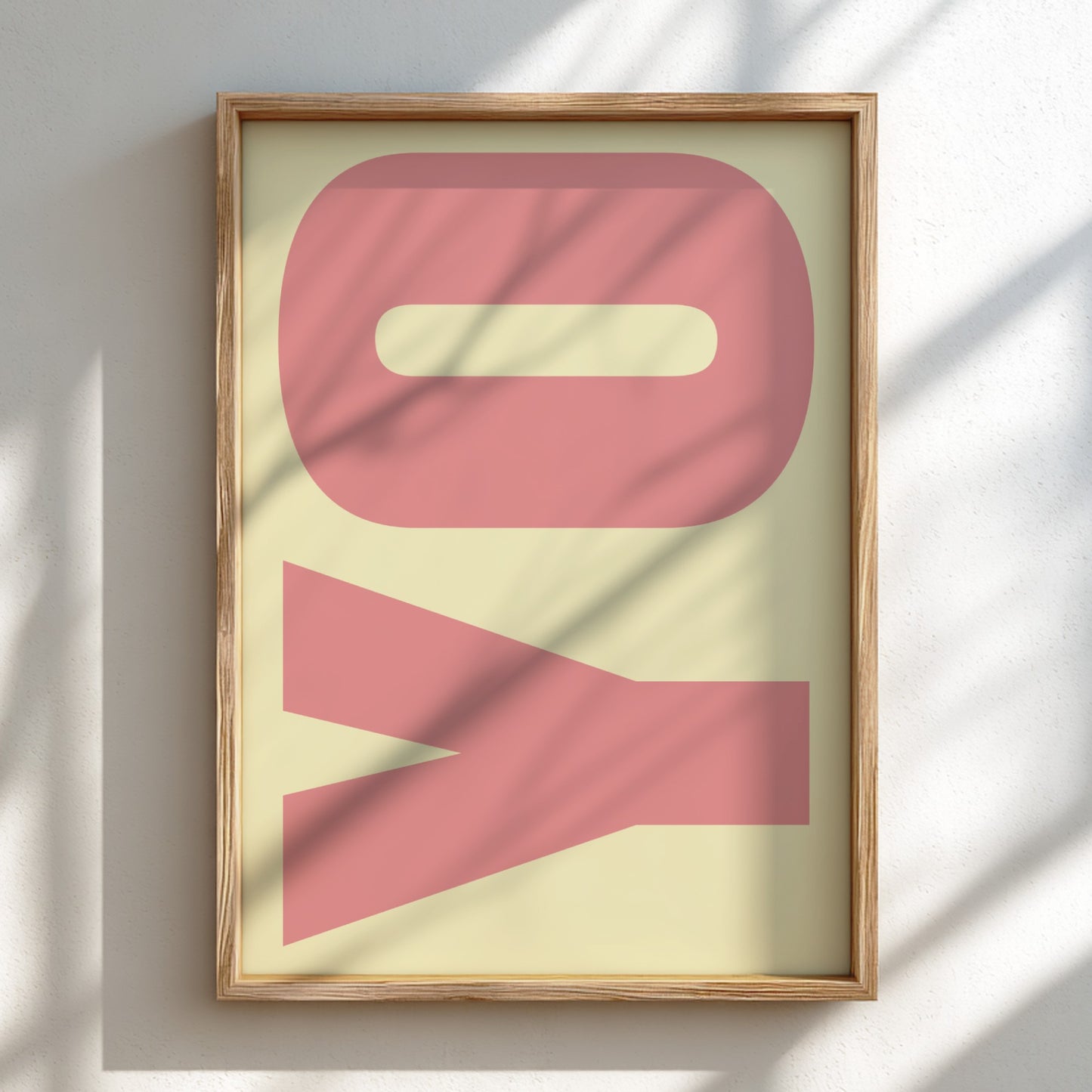 Framed artwork with pink abstract design on a light background