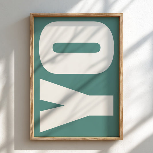 Framed artwork with 'YO' letters on a teal background