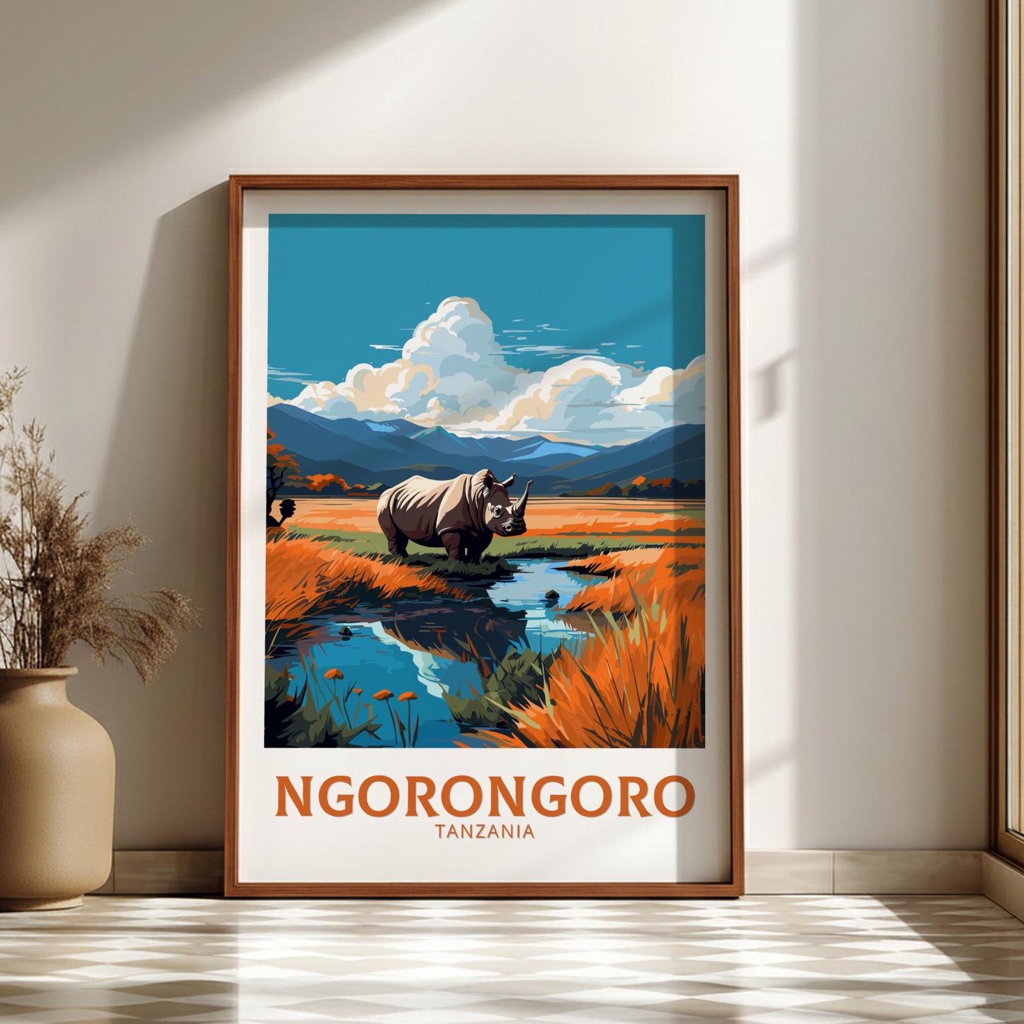 Framed poster of Ngorongoro Crater with a rhino in a natural setting, displayed on a wall.