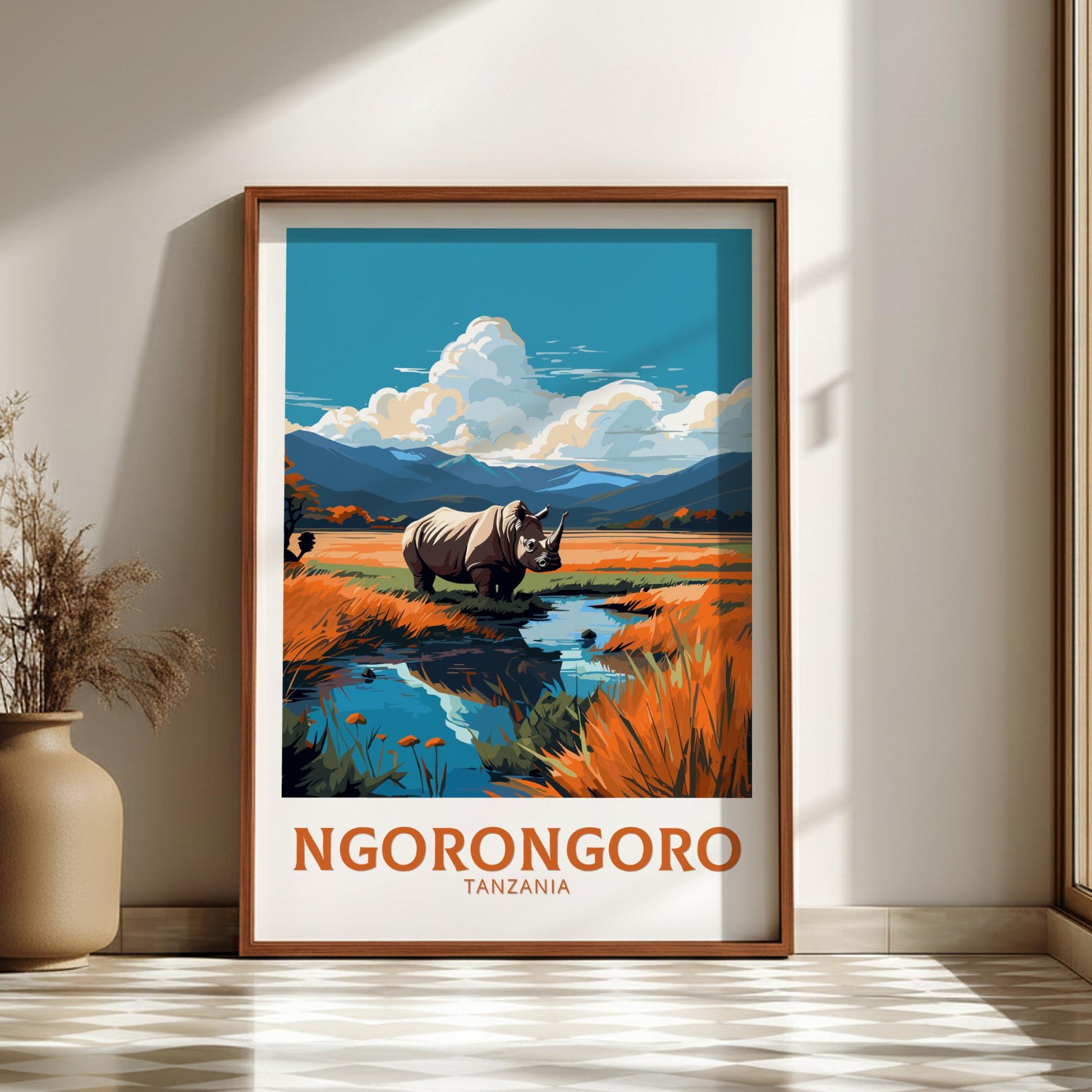 Framed poster of Ngorongoro Crater with a rhino in a natural setting, displayed on a wall.