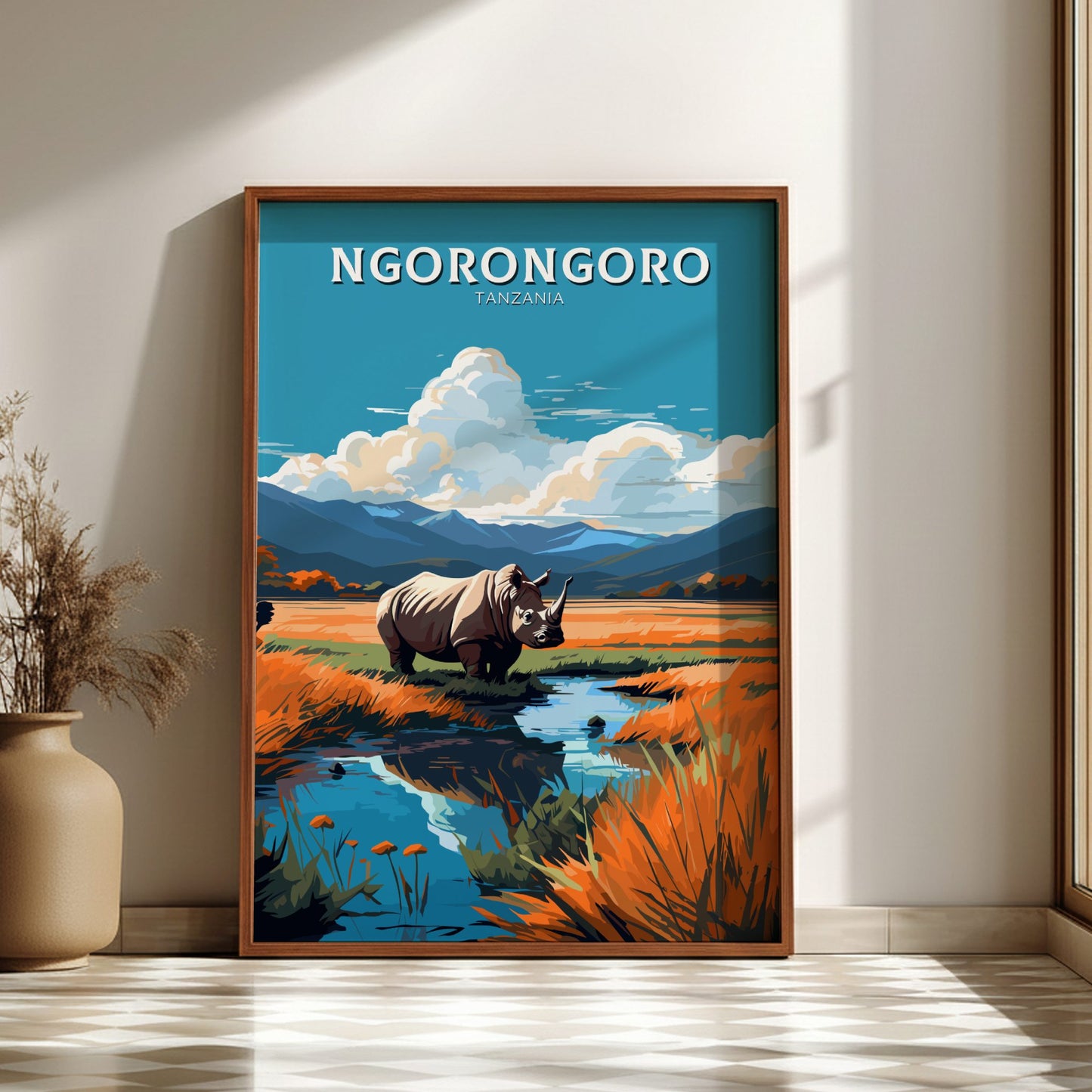 Framed artwork of a rhinoceros in a natural setting with 'Ngorongoro' text on a wall.