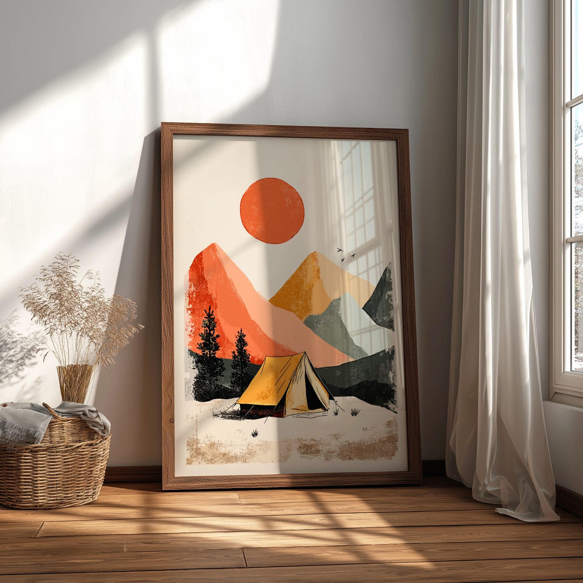 Framed artwork of a mountain landscape with a tent on a wooden floor.