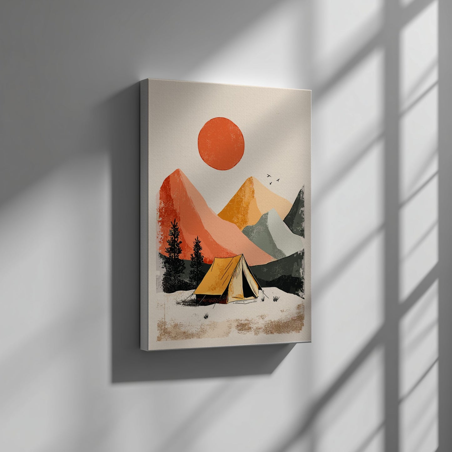 Canvas print of a mountain landscape with a tent and red sun on a white background, hanging on a wall.