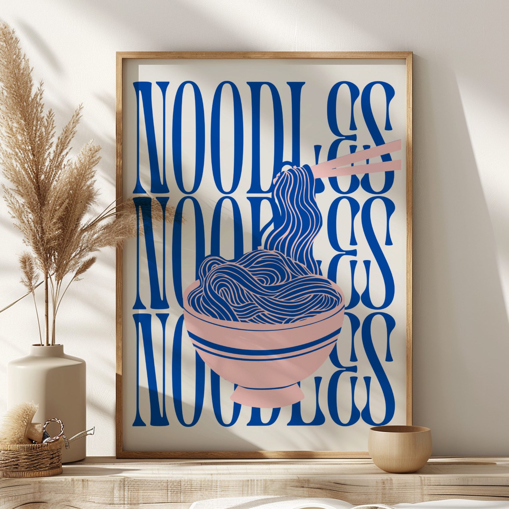 Framed artwork with blue text and illustration of noodles on a shelf.