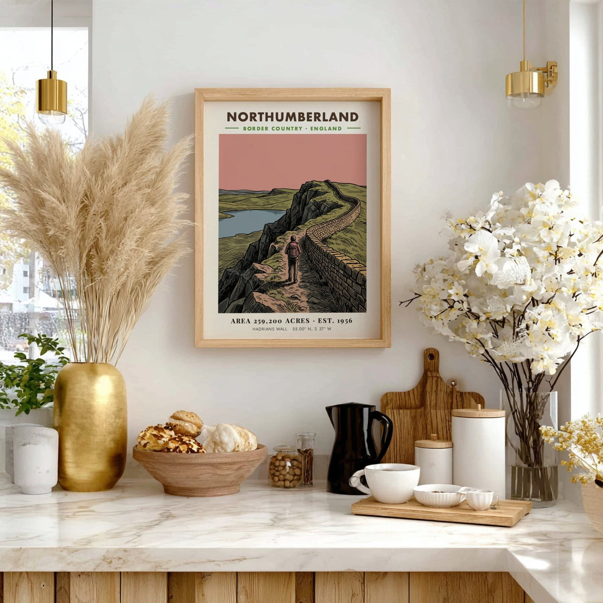 Poster showing a hiker walking along Hadrian's Wall in the Northumberland border country landscape.