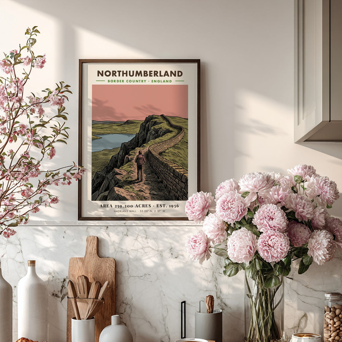 Poster showing a hiker walking along Hadrian's Wall in the Northumberland border country landscape.
