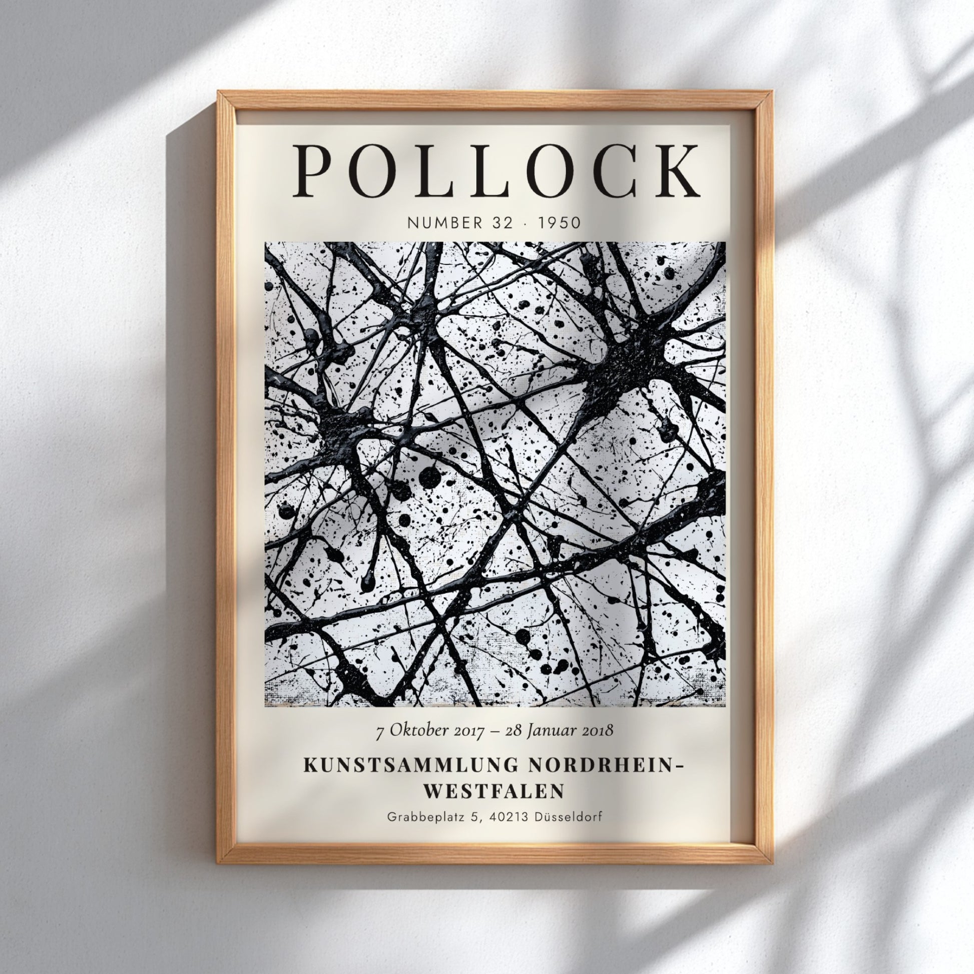 Wall art poster featuring Jackson Pollock Number 32 exhibition text with black ink splatters.