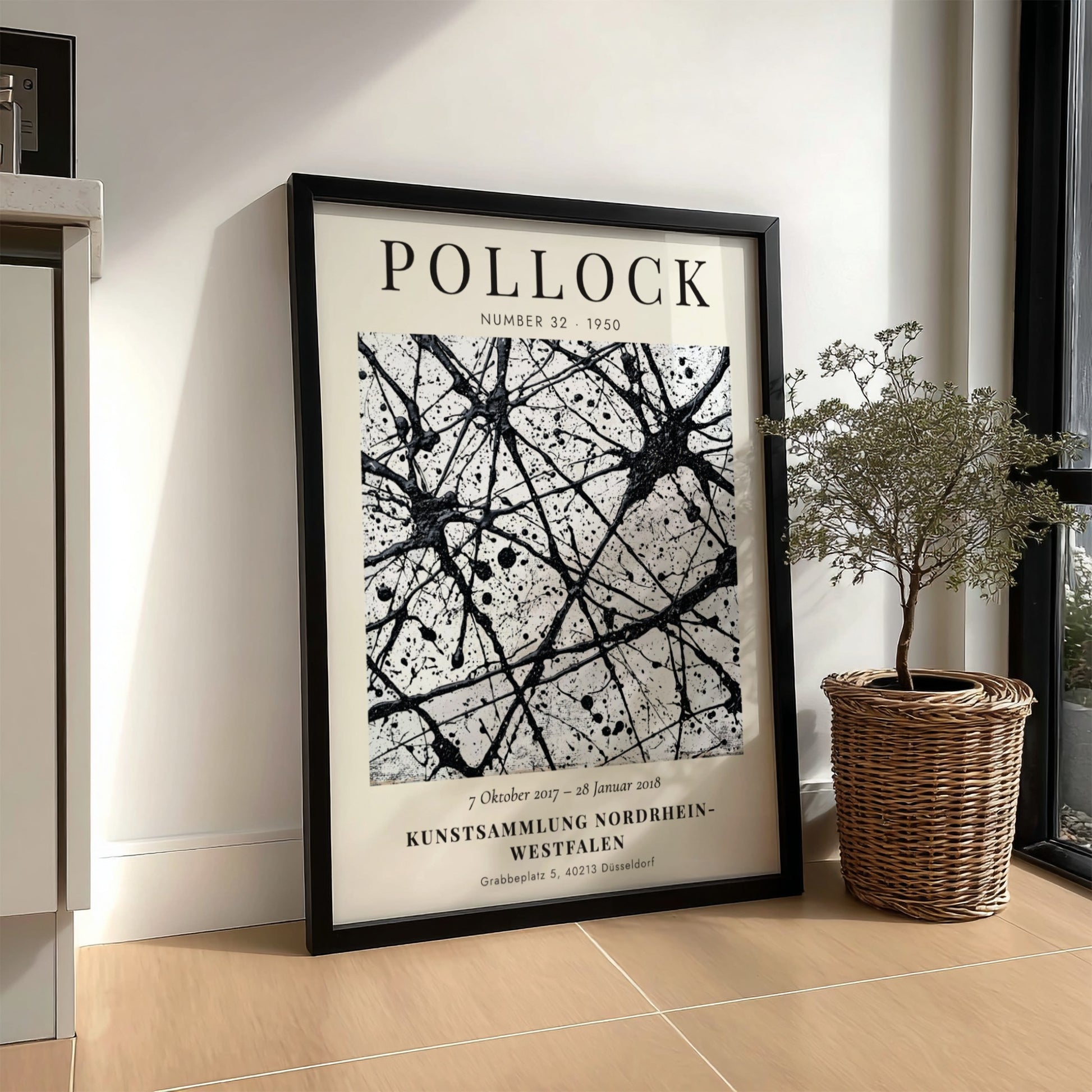 Wall art poster featuring Jackson Pollock Number 32 exhibition text with black ink splatters.