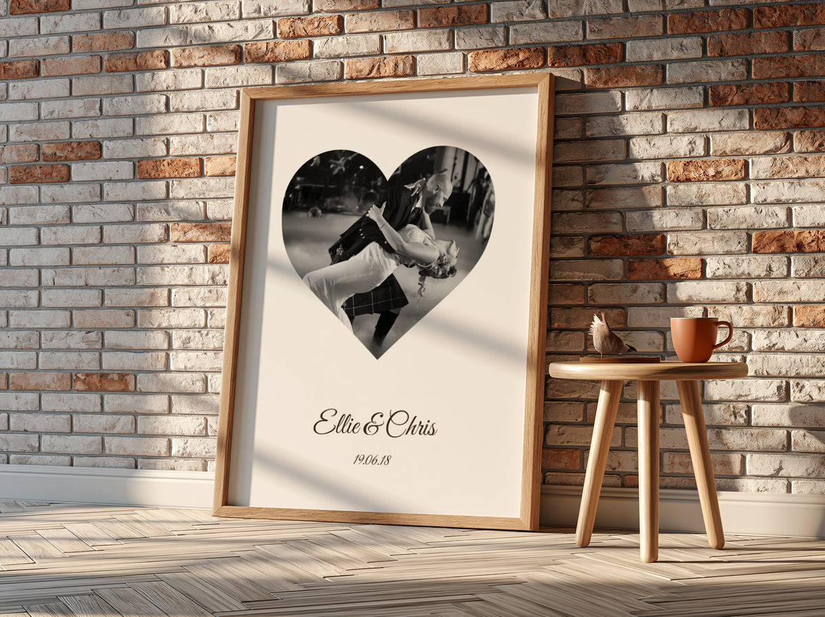 Personalised Heart Photo Poster in an oak frame against a brick wall