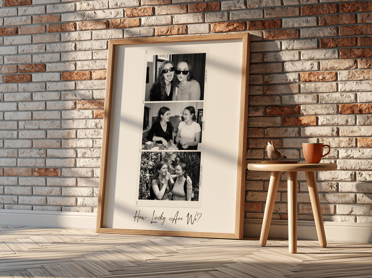Personalised Retro Film Strip Photo Poster in an oak frame against a brick wall