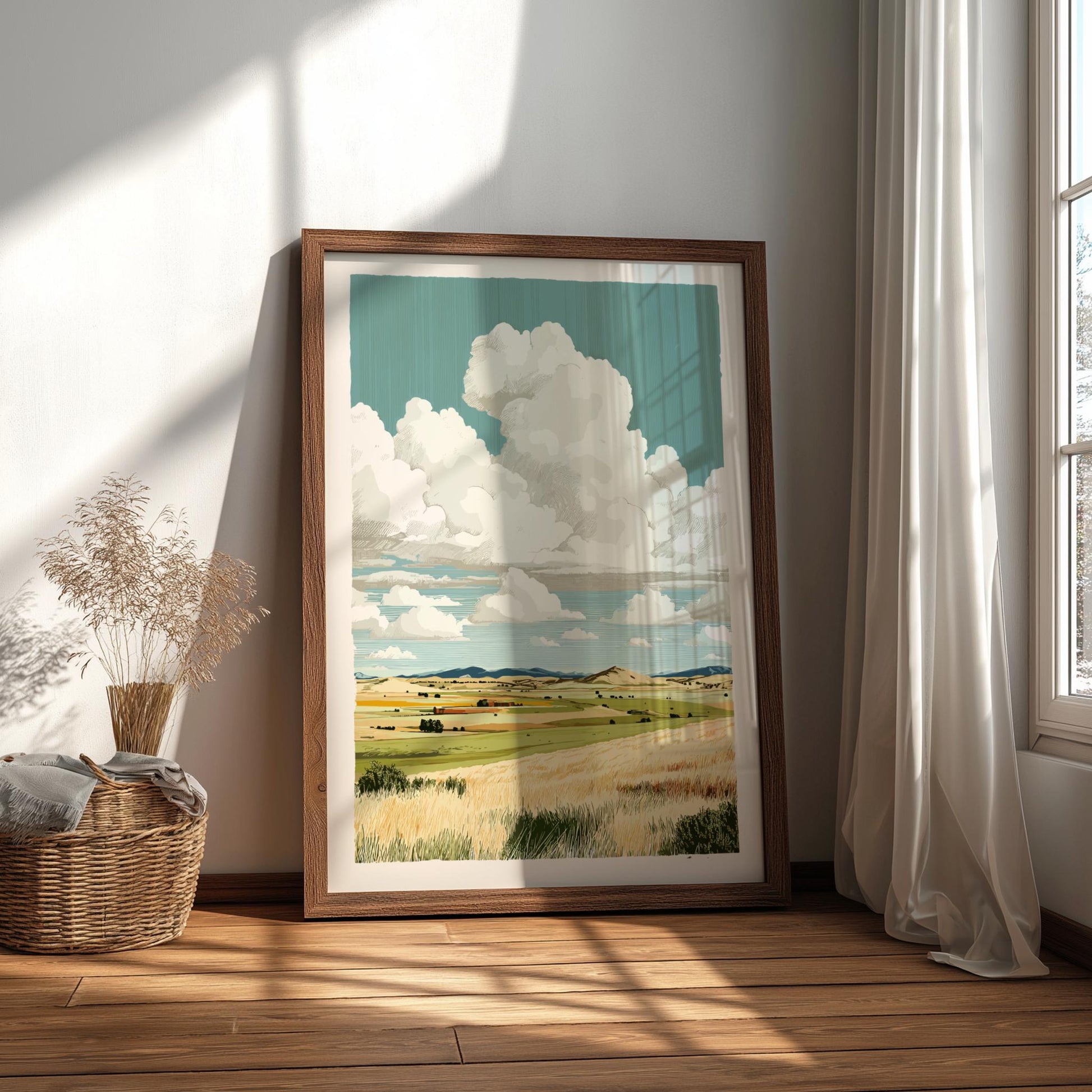 Framed landscape print of a field and sky in a room with natural light