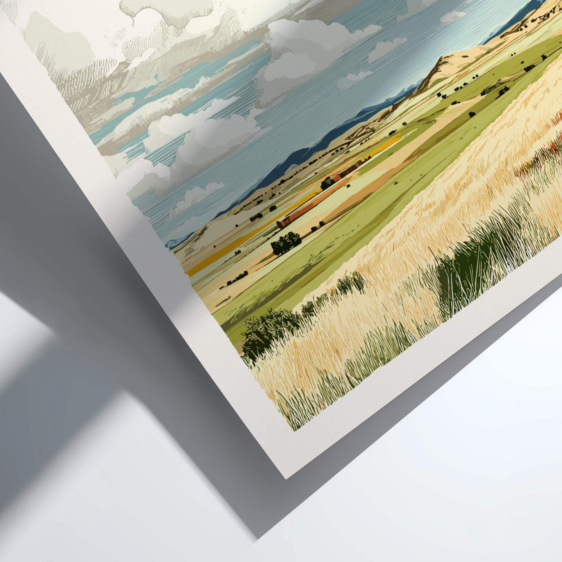 Framed artwork of a landscape with fields and sky.