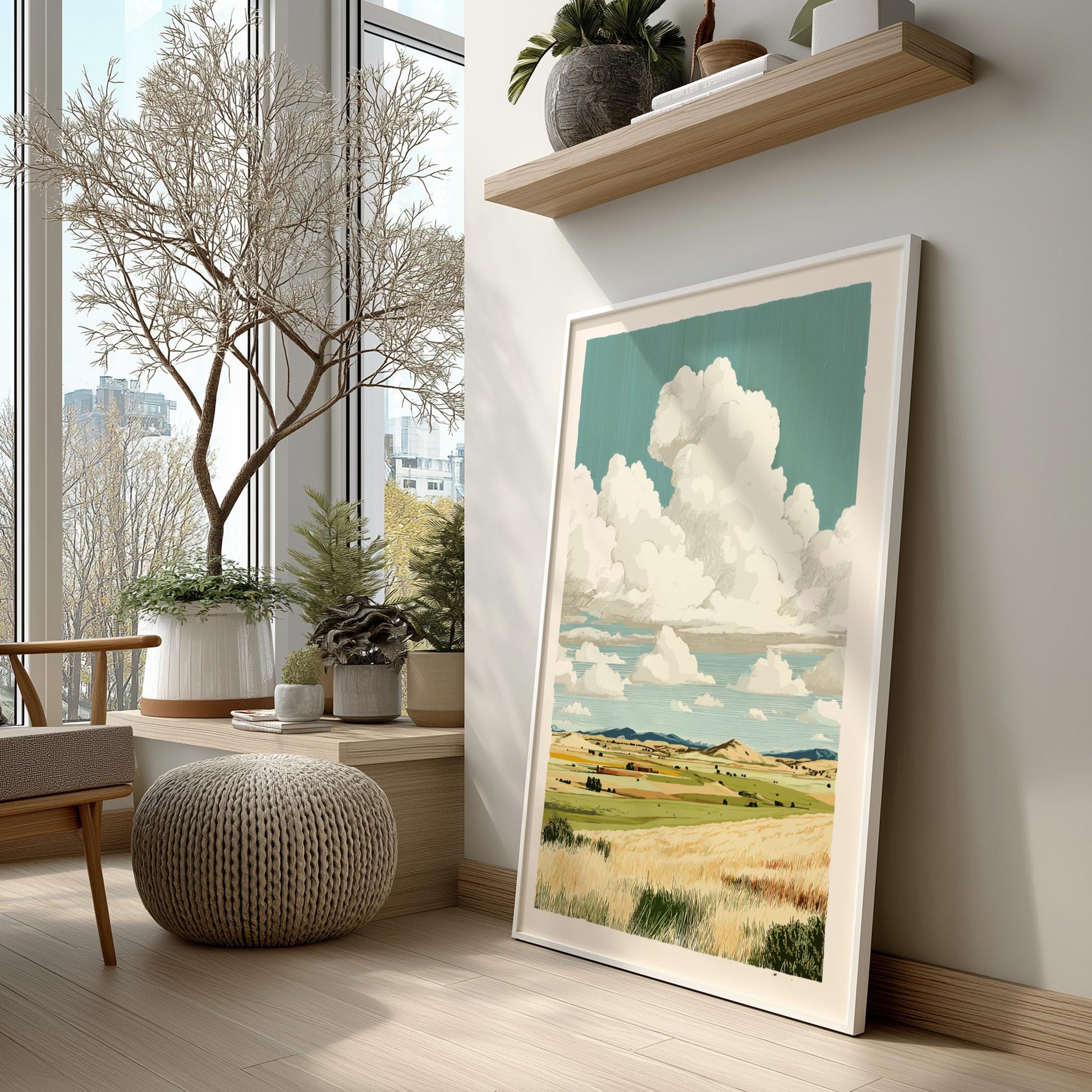 Framed landscape print on a wall in a modern living room with decor elements.