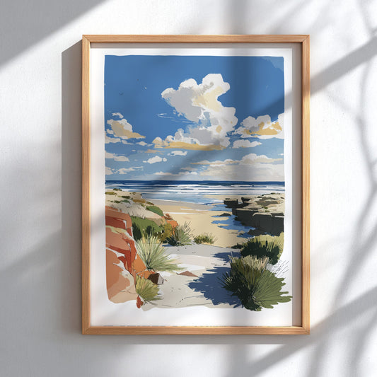 Framed artwork of a beach scene with a blue sky and clouds.