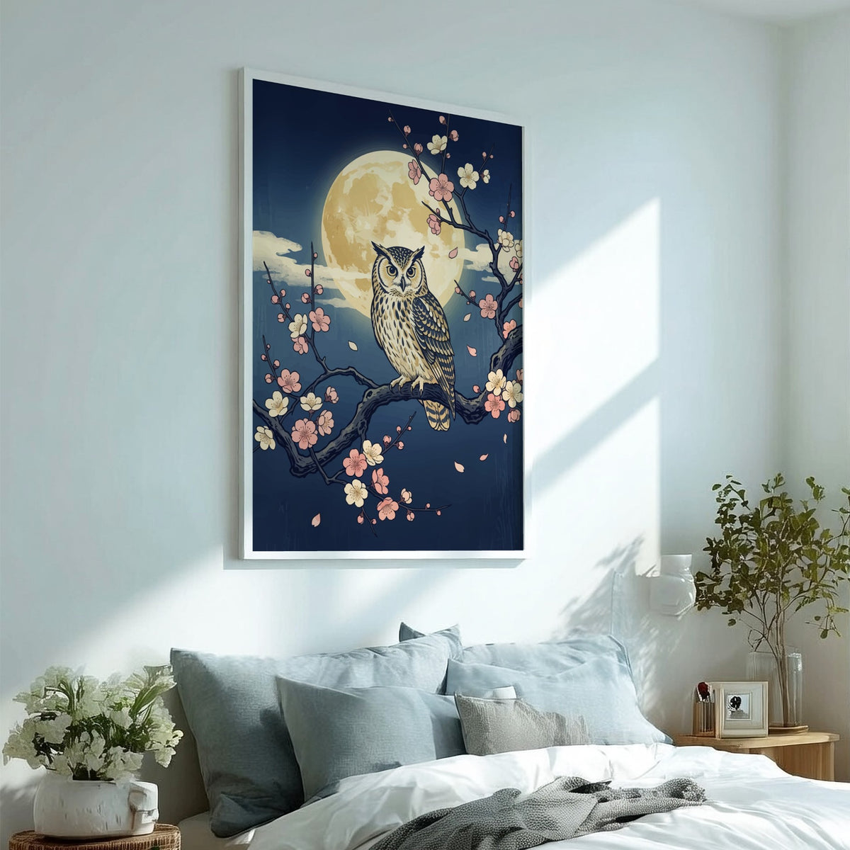 Owl perched on a plum blossom branch against a large full moon night sky