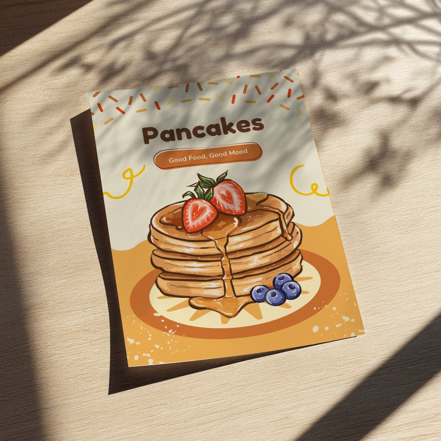 Pancakes packaging with strawberries and blueberries on a wooden surface