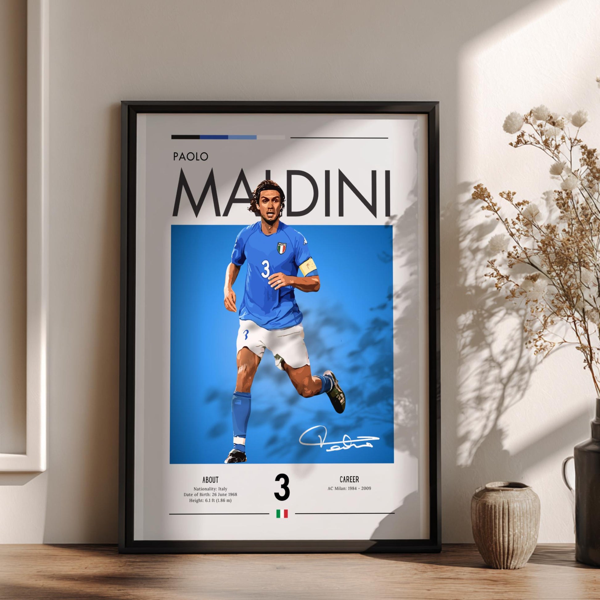 Framed poster of Paolo Maldini in a blue jersey on a white background