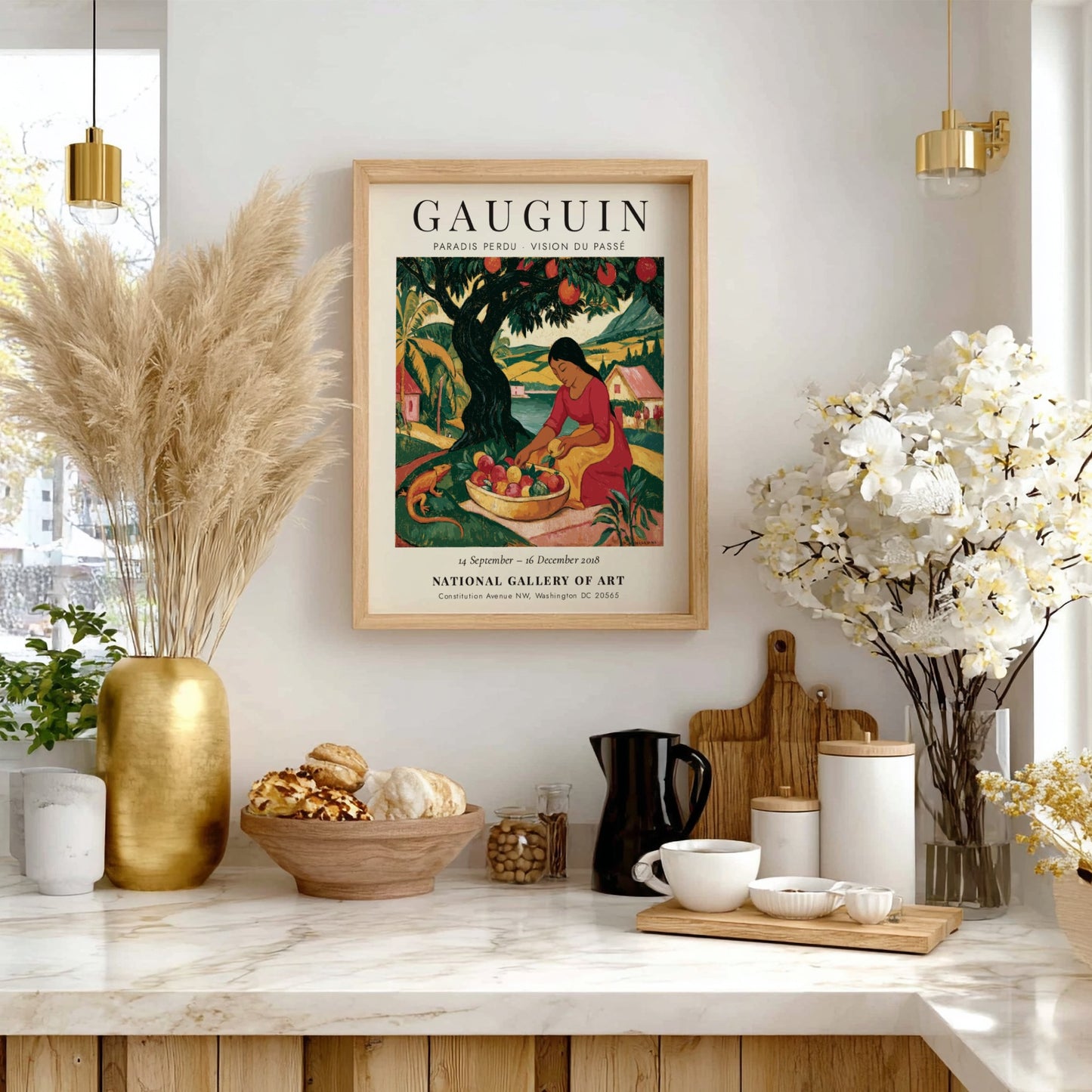 Gauguin exhibition poster featuring vibrant colors and a woman gathering fruit in a tropical landscape