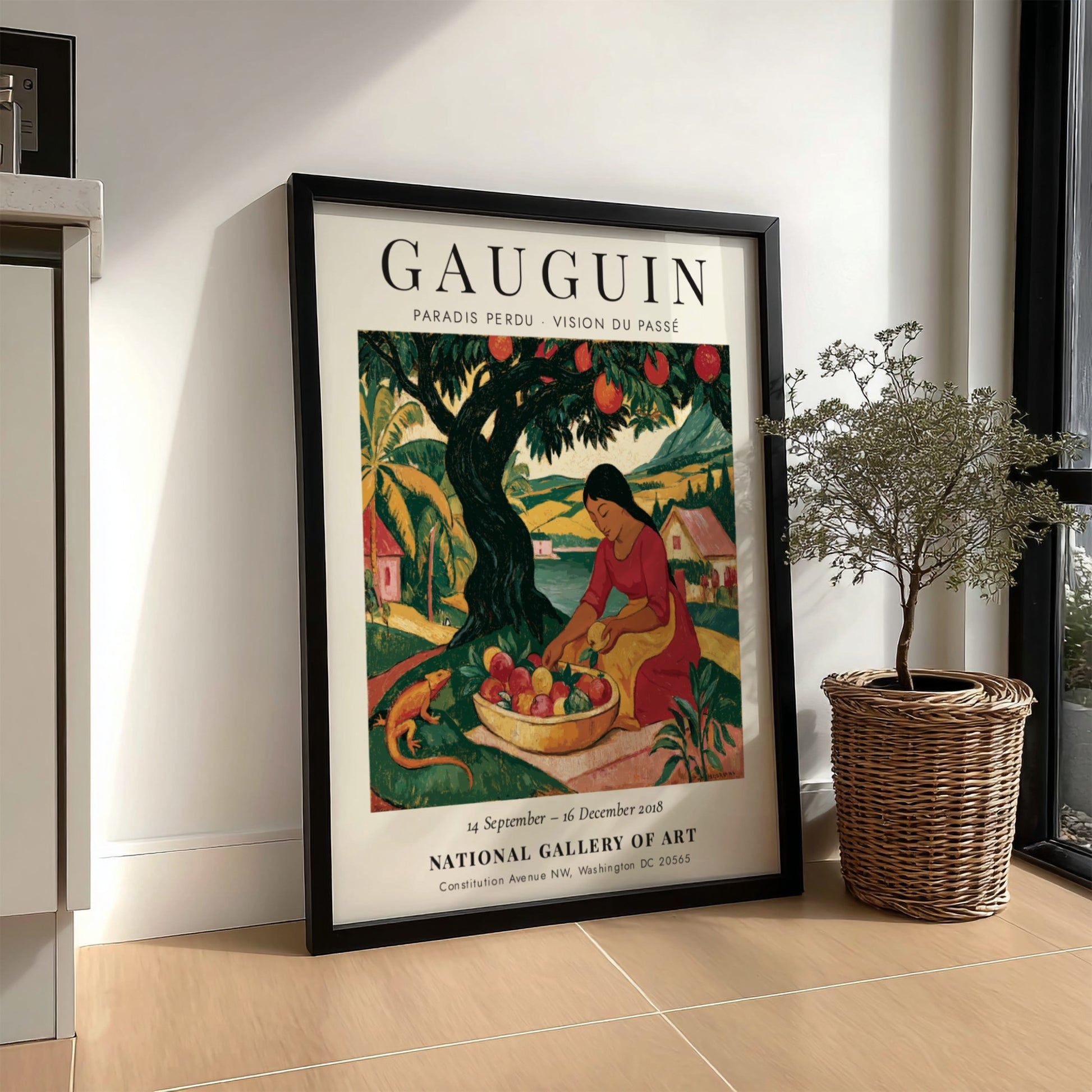 Gauguin exhibition poster featuring vibrant colors and a woman gathering fruit in a tropical landscape