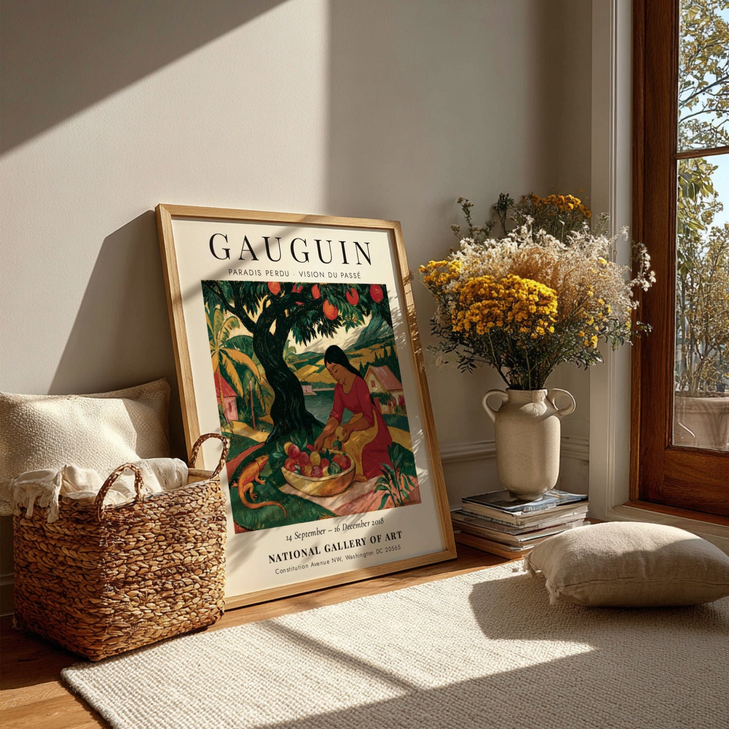 Gauguin exhibition poster featuring vibrant colors and a woman gathering fruit in a tropical landscape