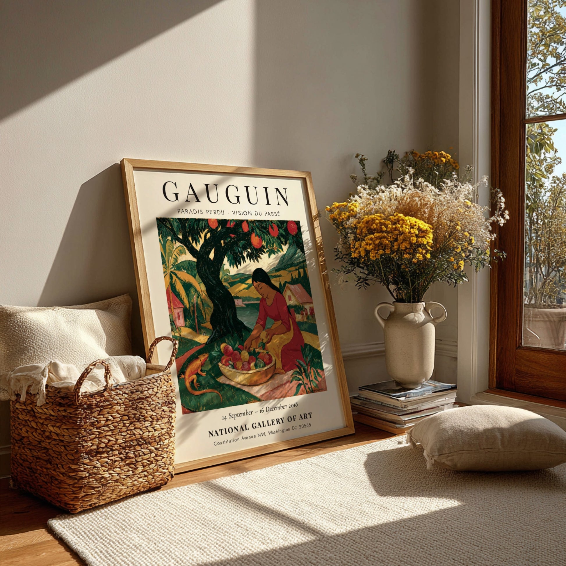Gauguin exhibition poster featuring vibrant colors and a woman gathering fruit in a tropical landscape