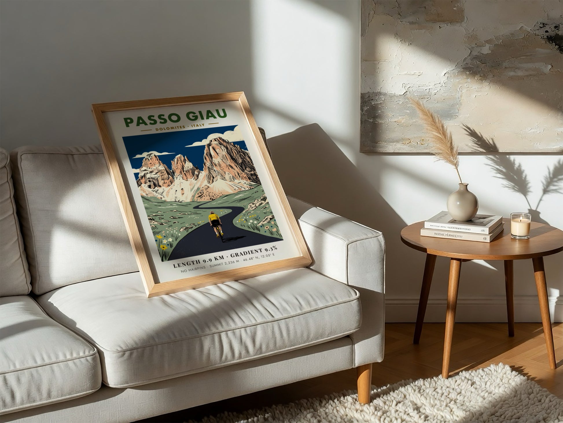 Passo Giau poster showing a cyclist riding toward jagged limestone mountains in Italy.