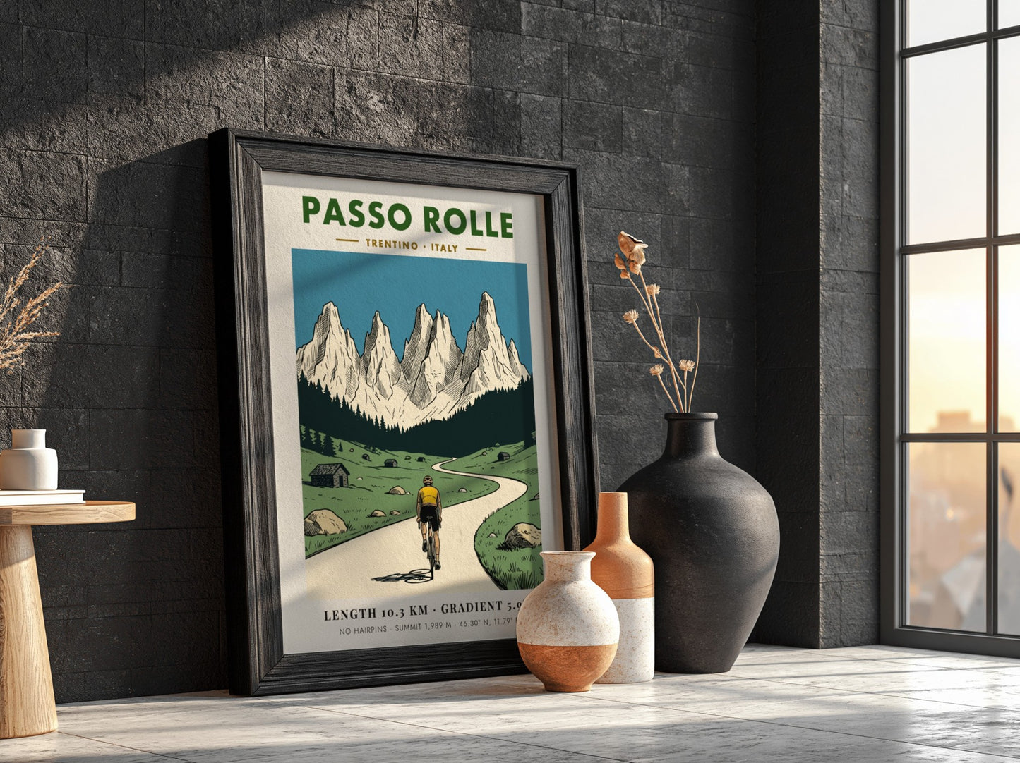 Poster of a cyclist climbing a mountain road toward the jagged Passo Rolle peaks.