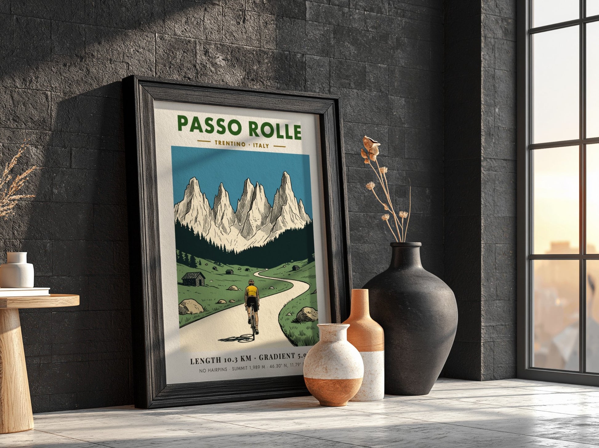Poster of a cyclist climbing a mountain road toward the jagged Passo Rolle peaks.